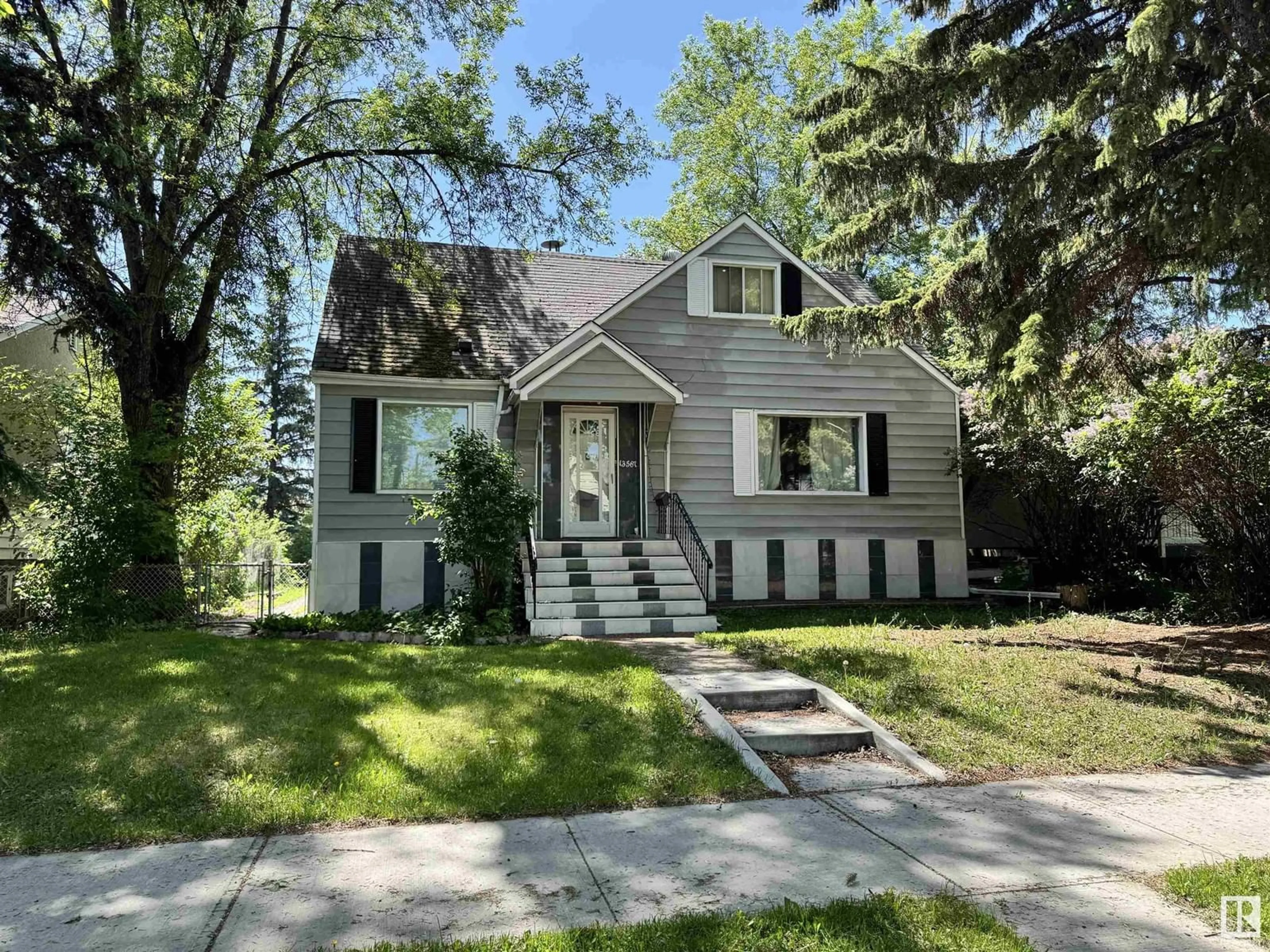 Home with vinyl exterior material, street for NW - 13567 107A AV, Edmonton Alberta T5M2A6