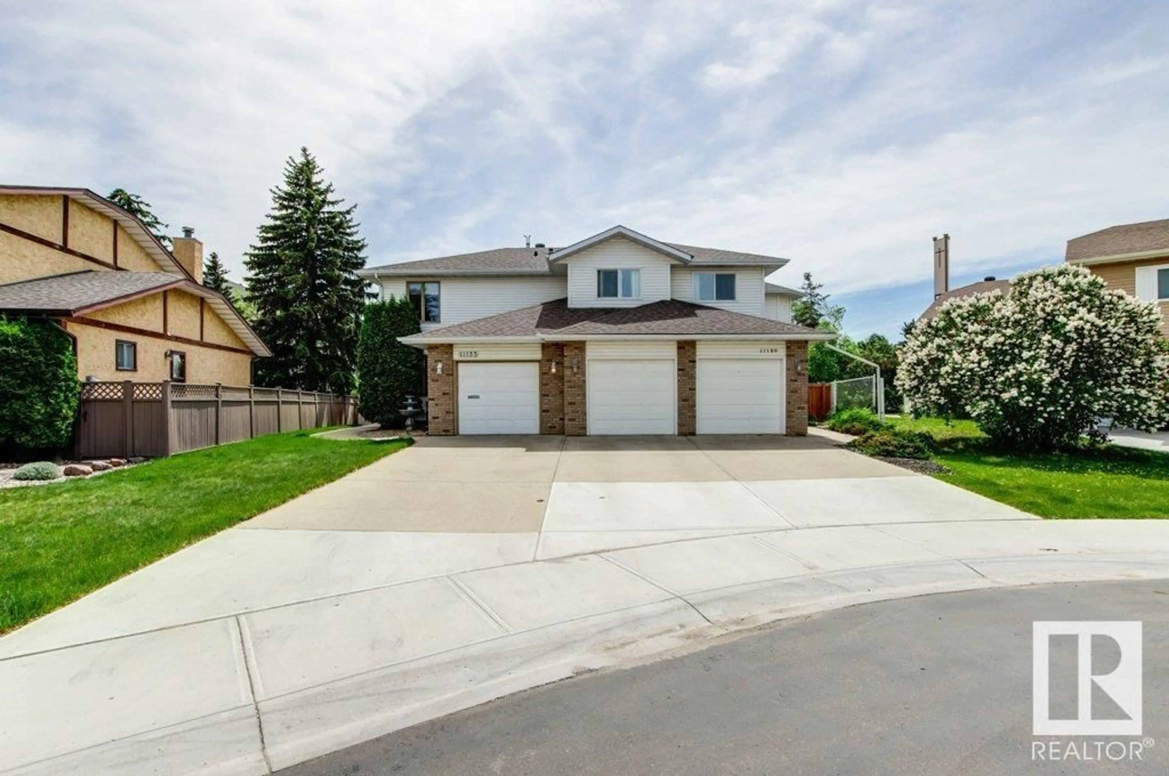 Home with vinyl exterior material, street for NW - 11135 157 AV, Edmonton Alberta T5X4V1