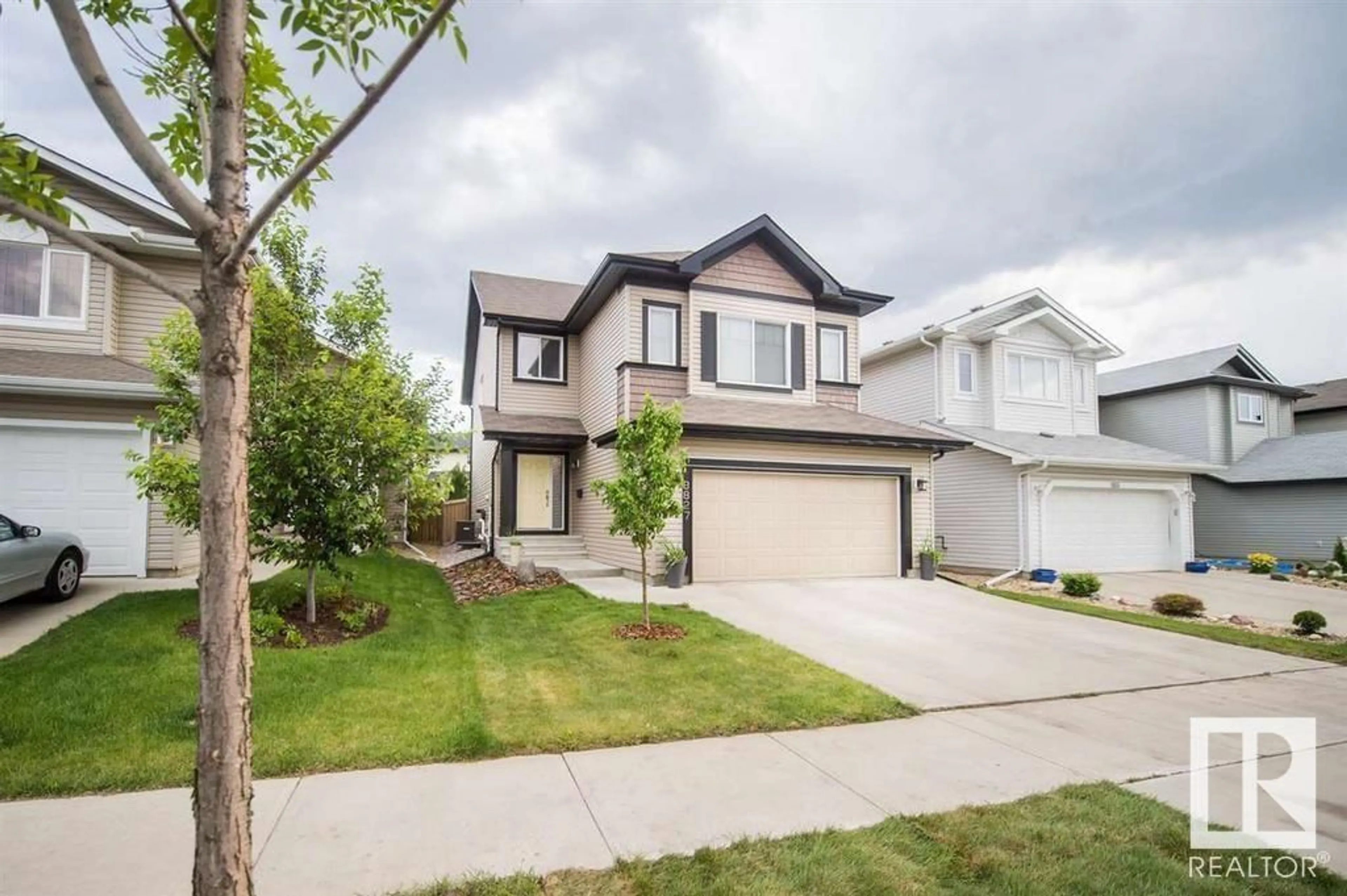 Home with vinyl exterior material, street for 8827 180 AV, Edmonton Alberta T5Z0C4