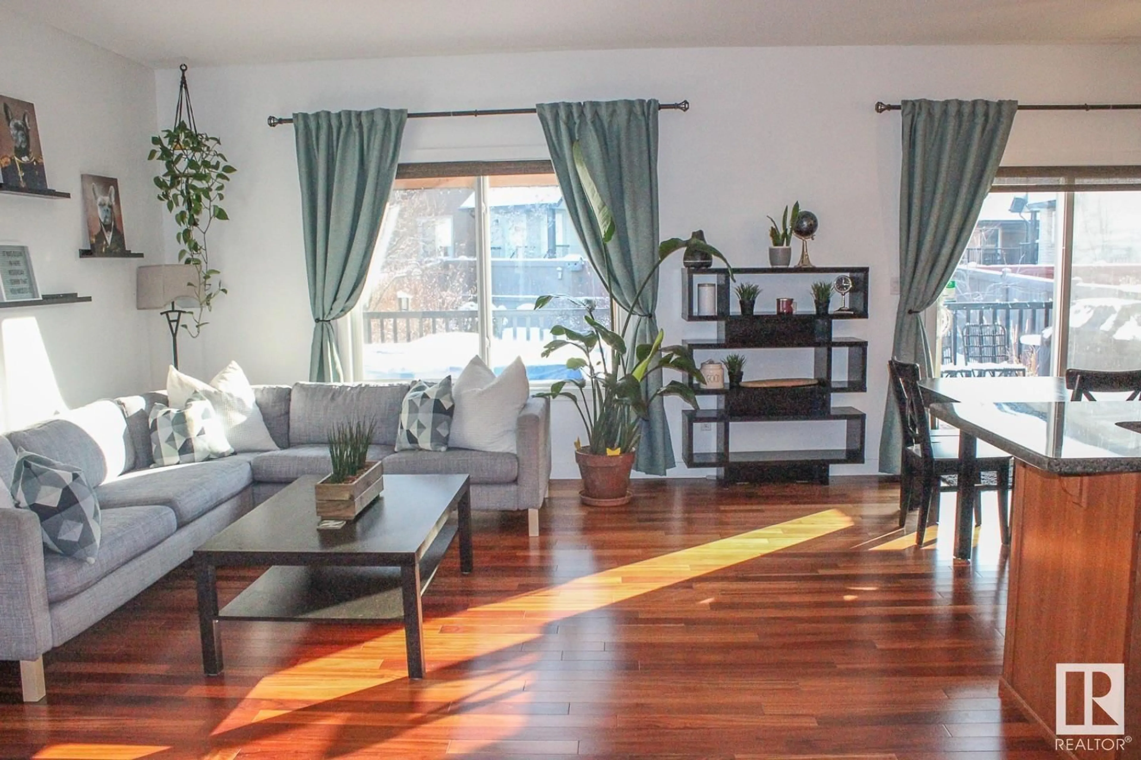Living room with furniture, wood/laminate floor for 8827 180 AV, Edmonton Alberta T5Z0C4