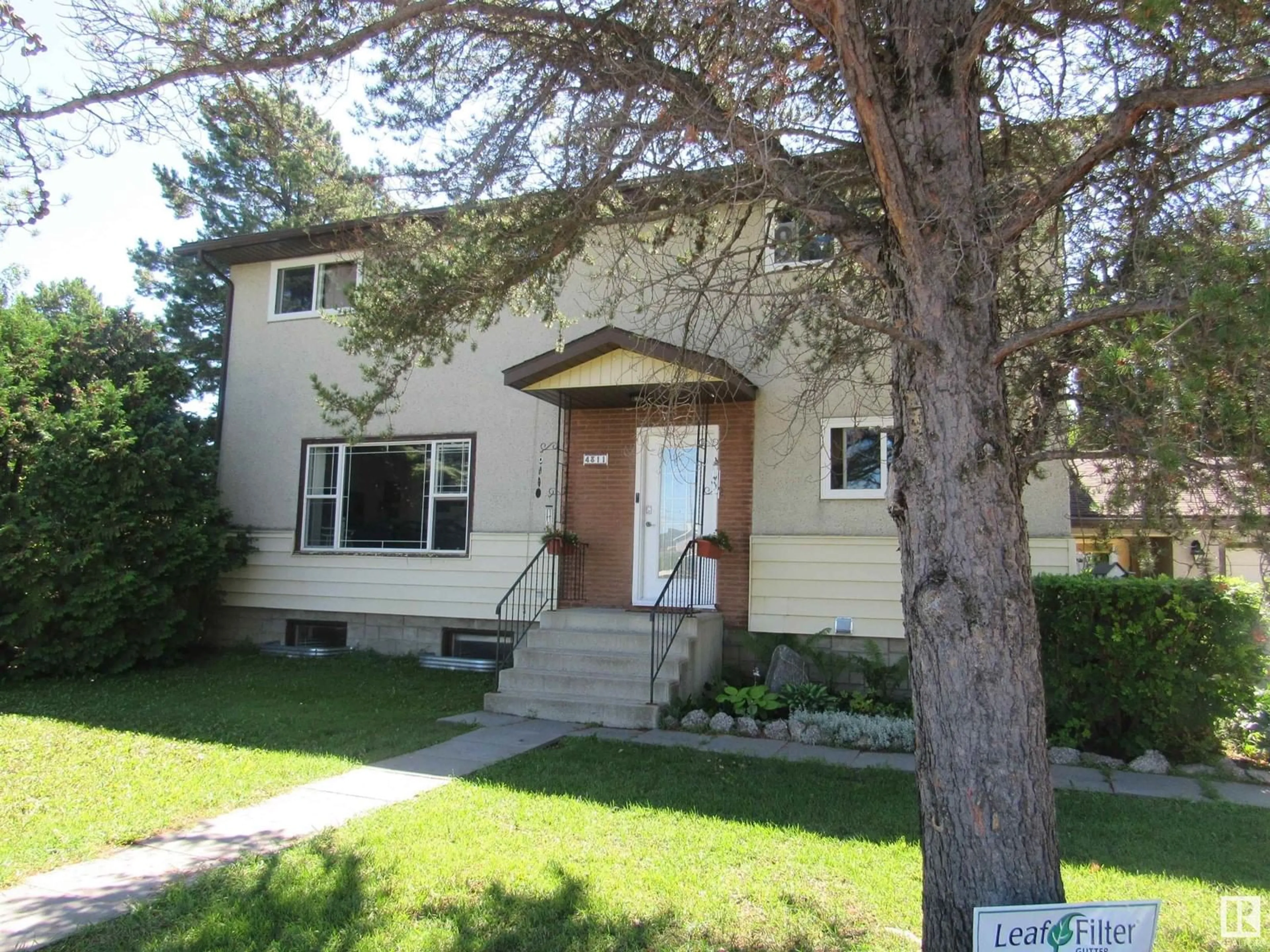 Home with vinyl exterior material, street for 4311 57 AV, Barrhead Alberta T7N1K3