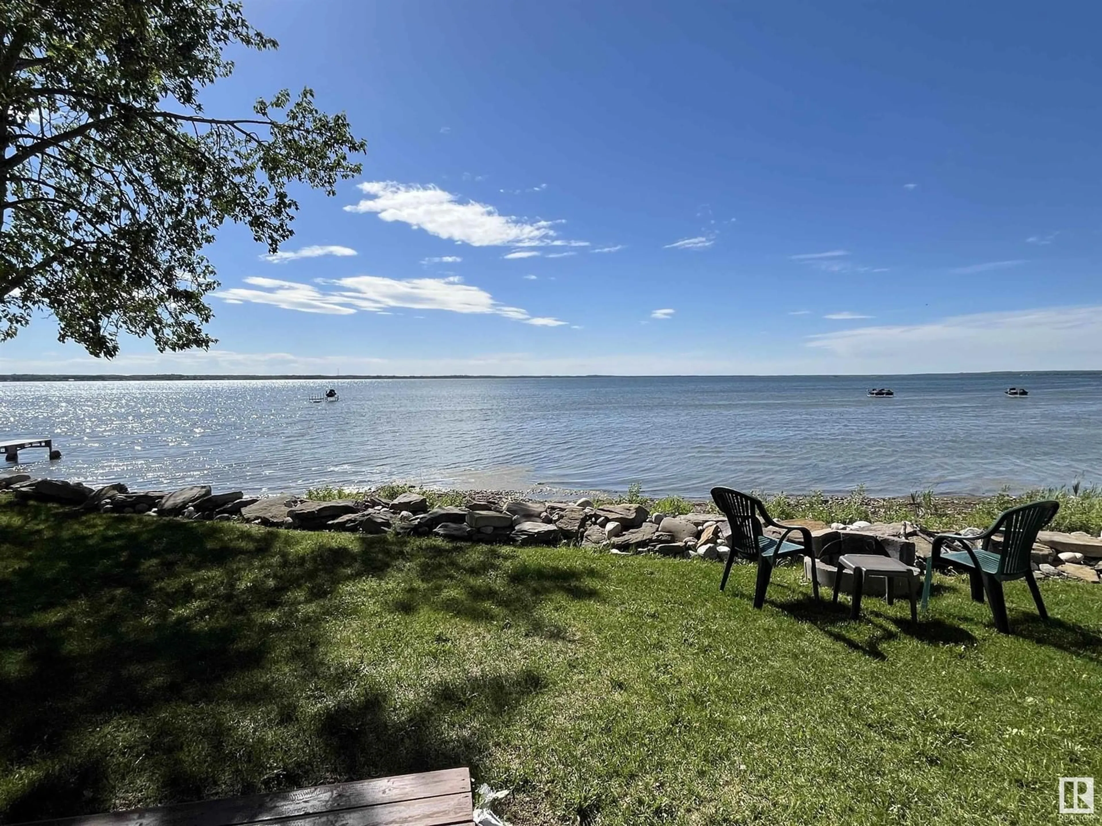 A pic from outside/outdoor area/front of a property/back of a property/a pic from drone, water/lake/river/ocean view for 4412 SUNSET DR, Rural Lac Ste. Anne County Alberta T0E0A0