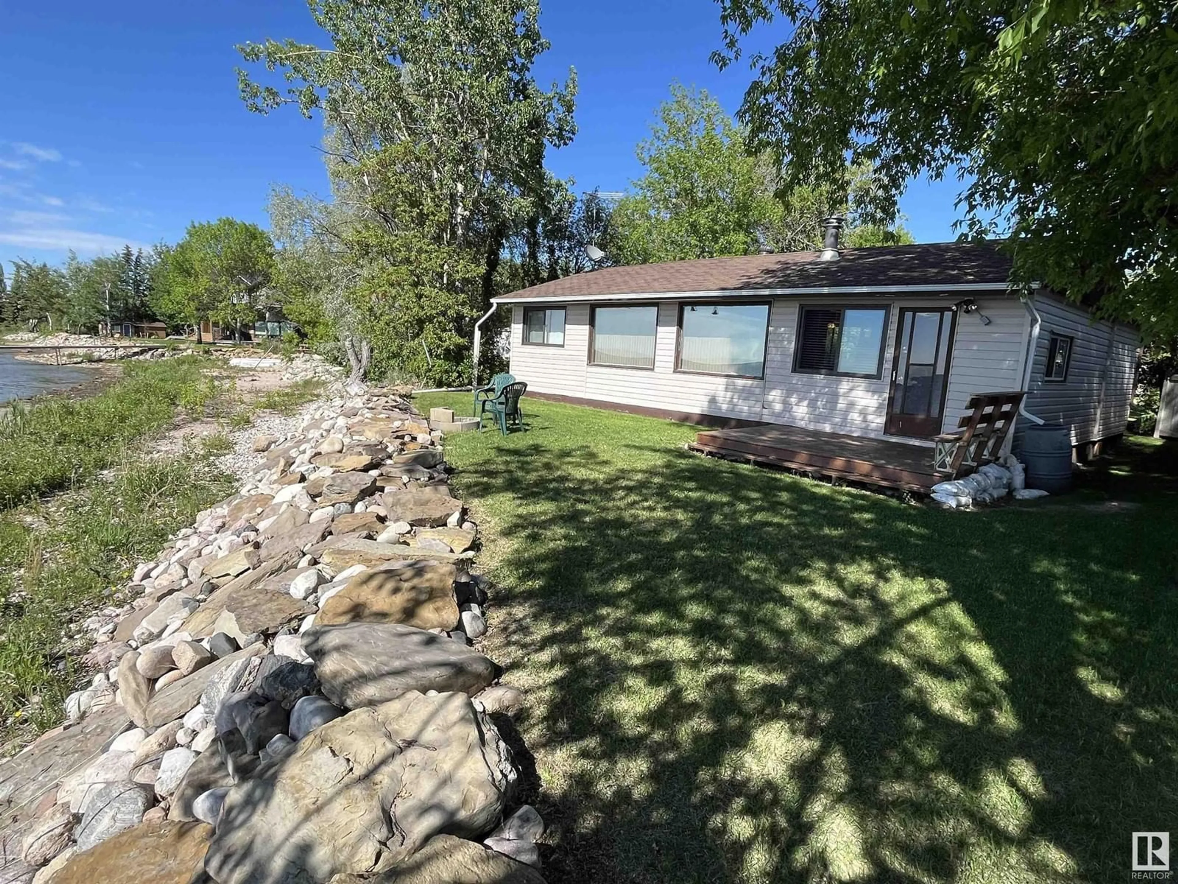 A pic from outside/outdoor area/front of a property/back of a property/a pic from drone, water/lake/river/ocean view for 4412 SUNSET DR, Rural Lac Ste. Anne County Alberta T0E0A0