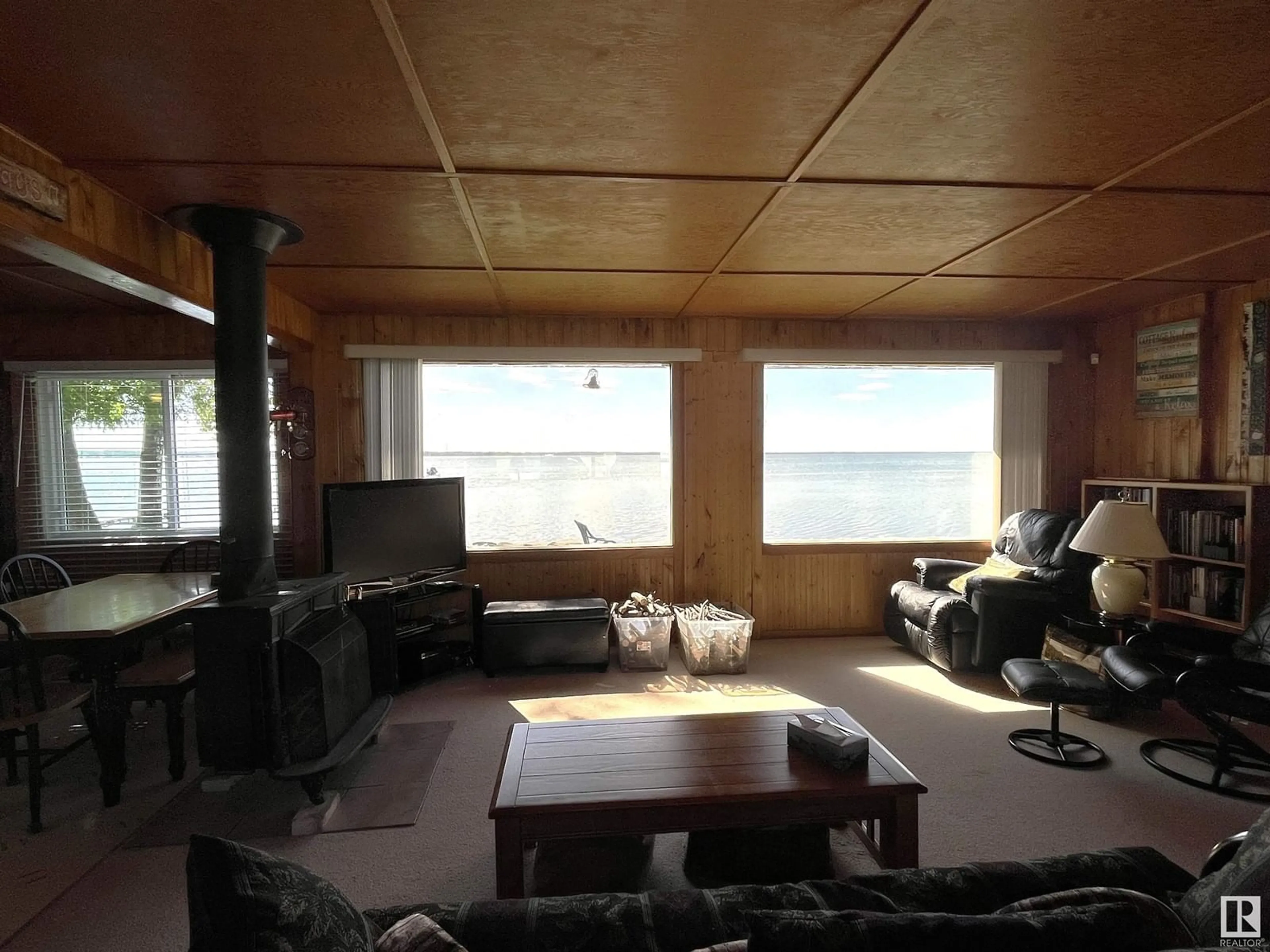 Living room with furniture, wood/laminate floor for 4412 SUNSET DR, Rural Lac Ste. Anne County Alberta T0E0A0