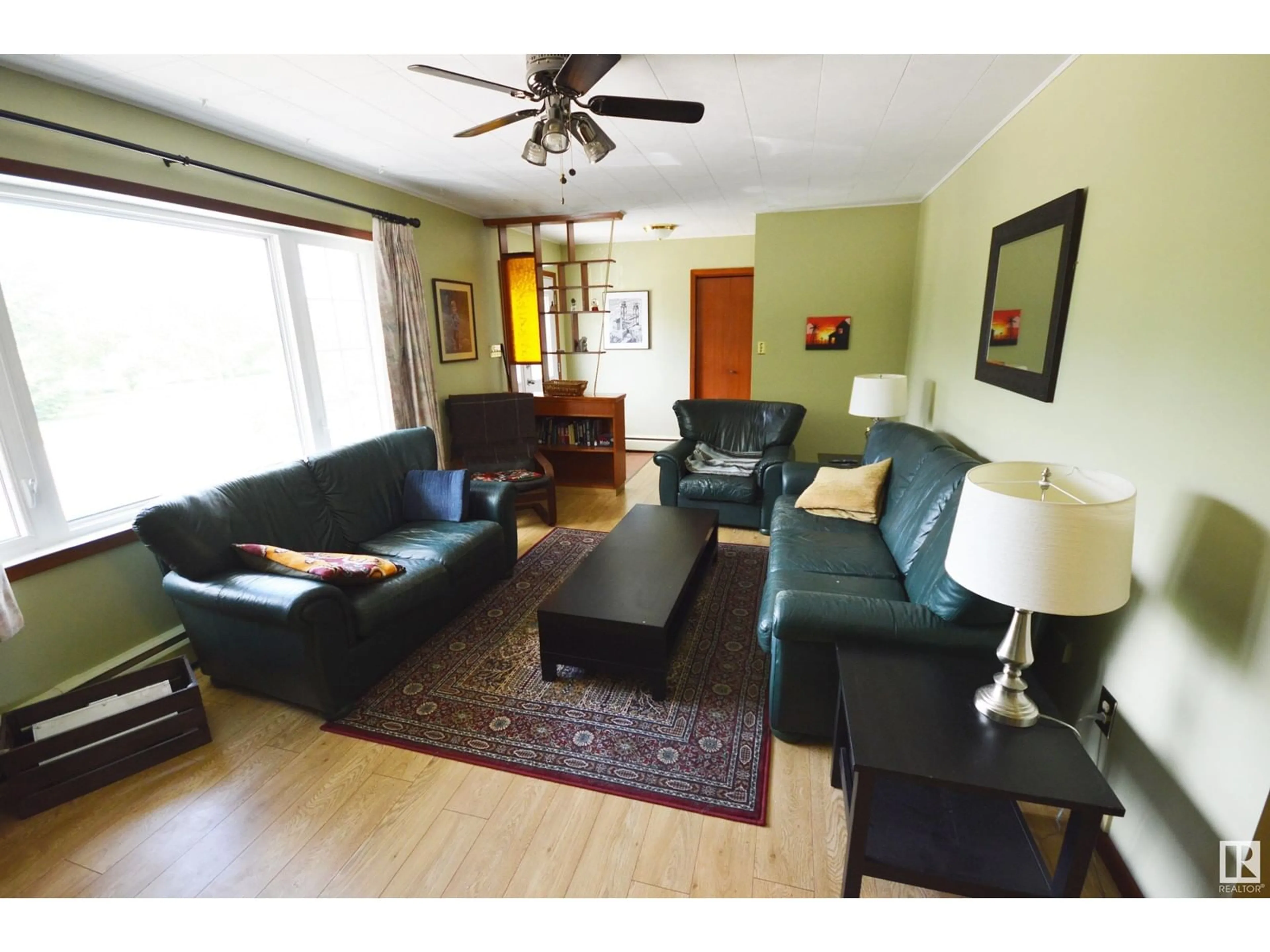 Living room with furniture, wood/laminate floor for 5003 LAKESHORE DR, Bonnyville Town Alberta T9N2J6