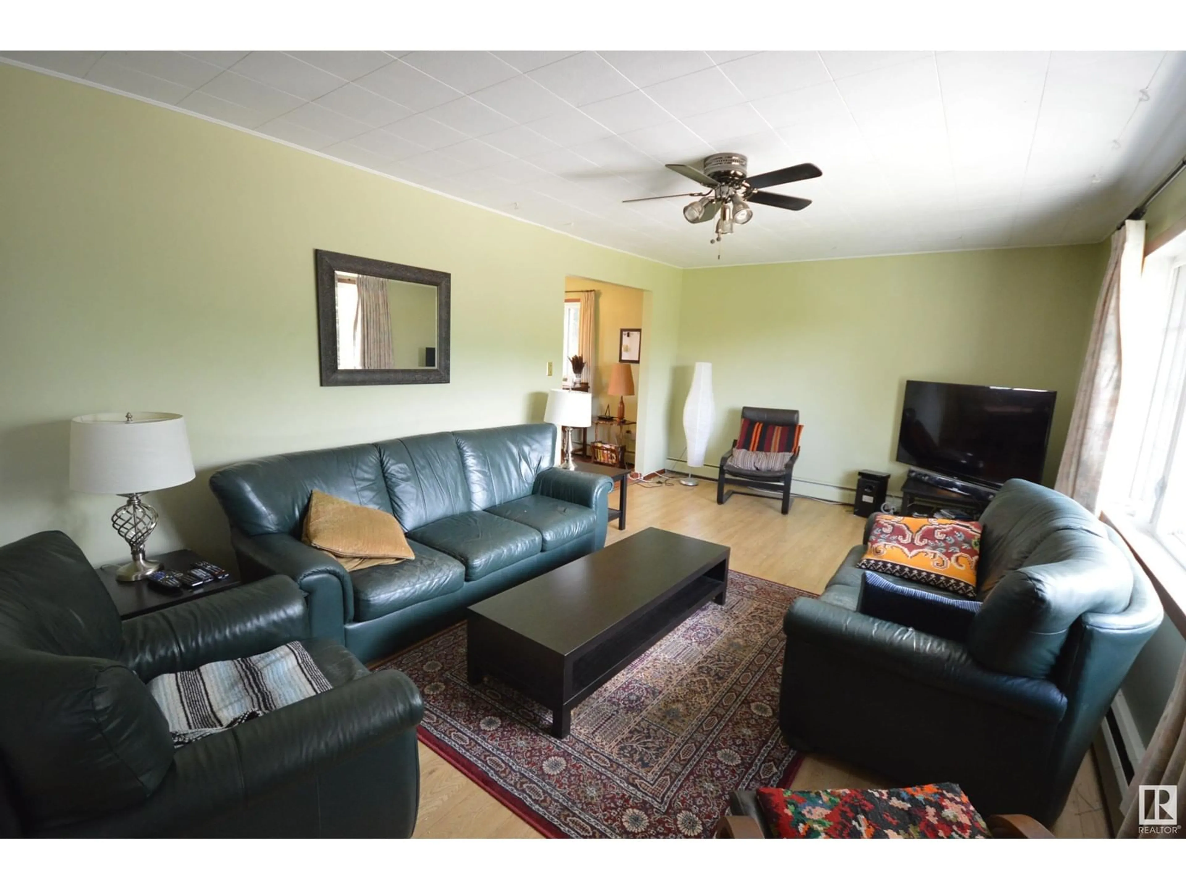 Living room with furniture, wood/laminate floor for 5003 LAKESHORE DR, Bonnyville Town Alberta T9N2J6