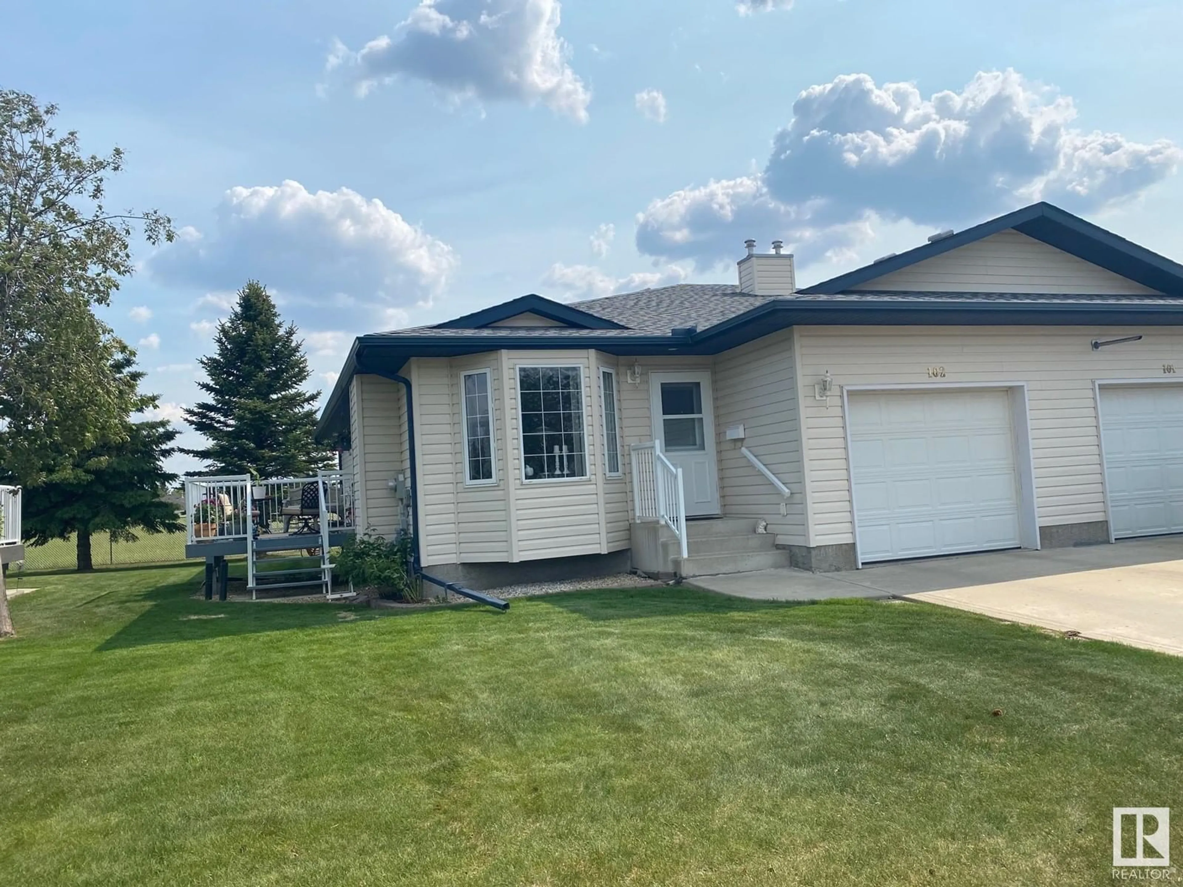 Home with vinyl exterior material, street for 102 - 7000 DR, Wetaskiwin Alberta T9A3R9