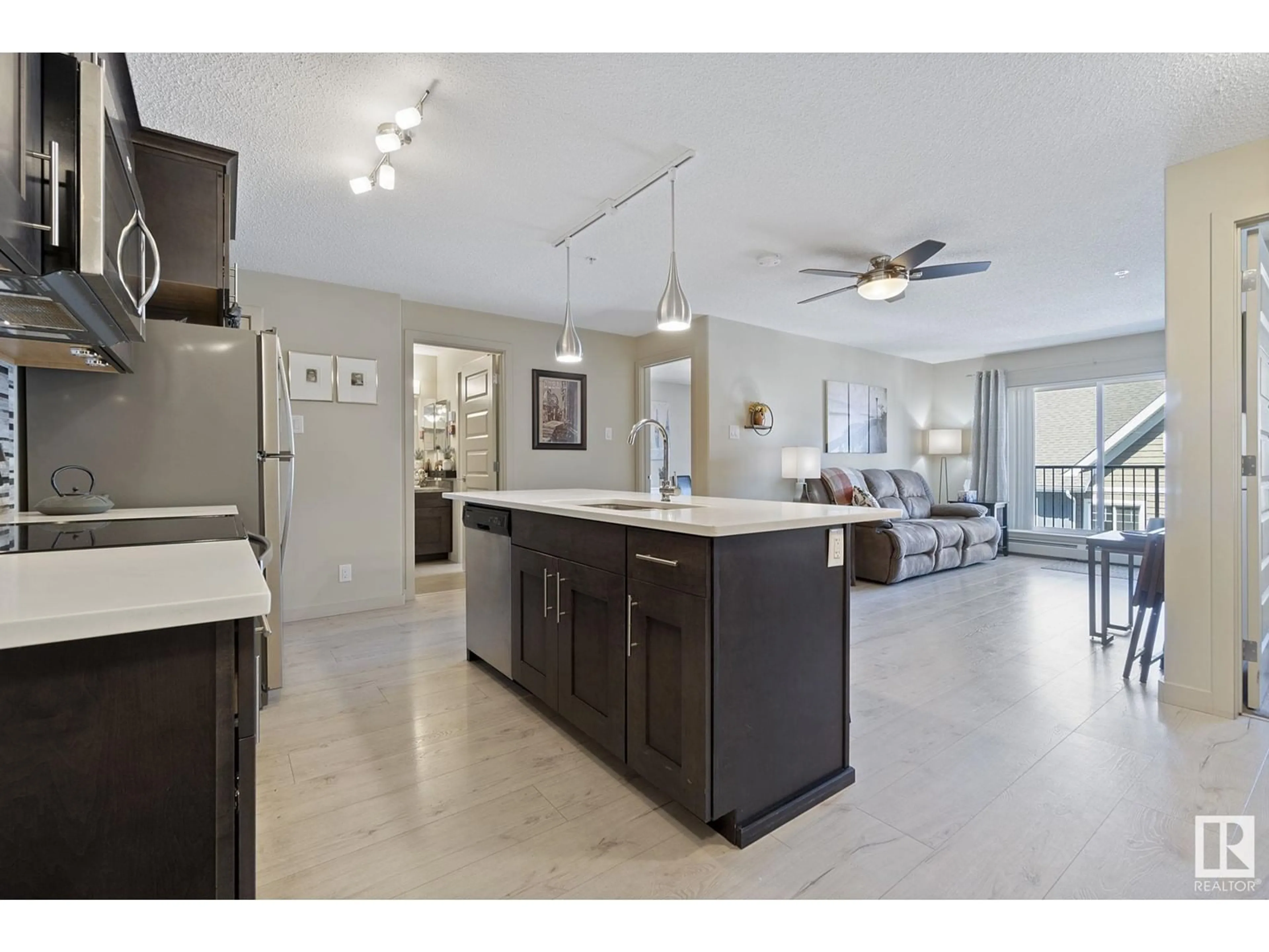 Open concept kitchen, ceramic/tile floor for #305 - 4008 SAVARYN DR, Edmonton Alberta T6X2E5