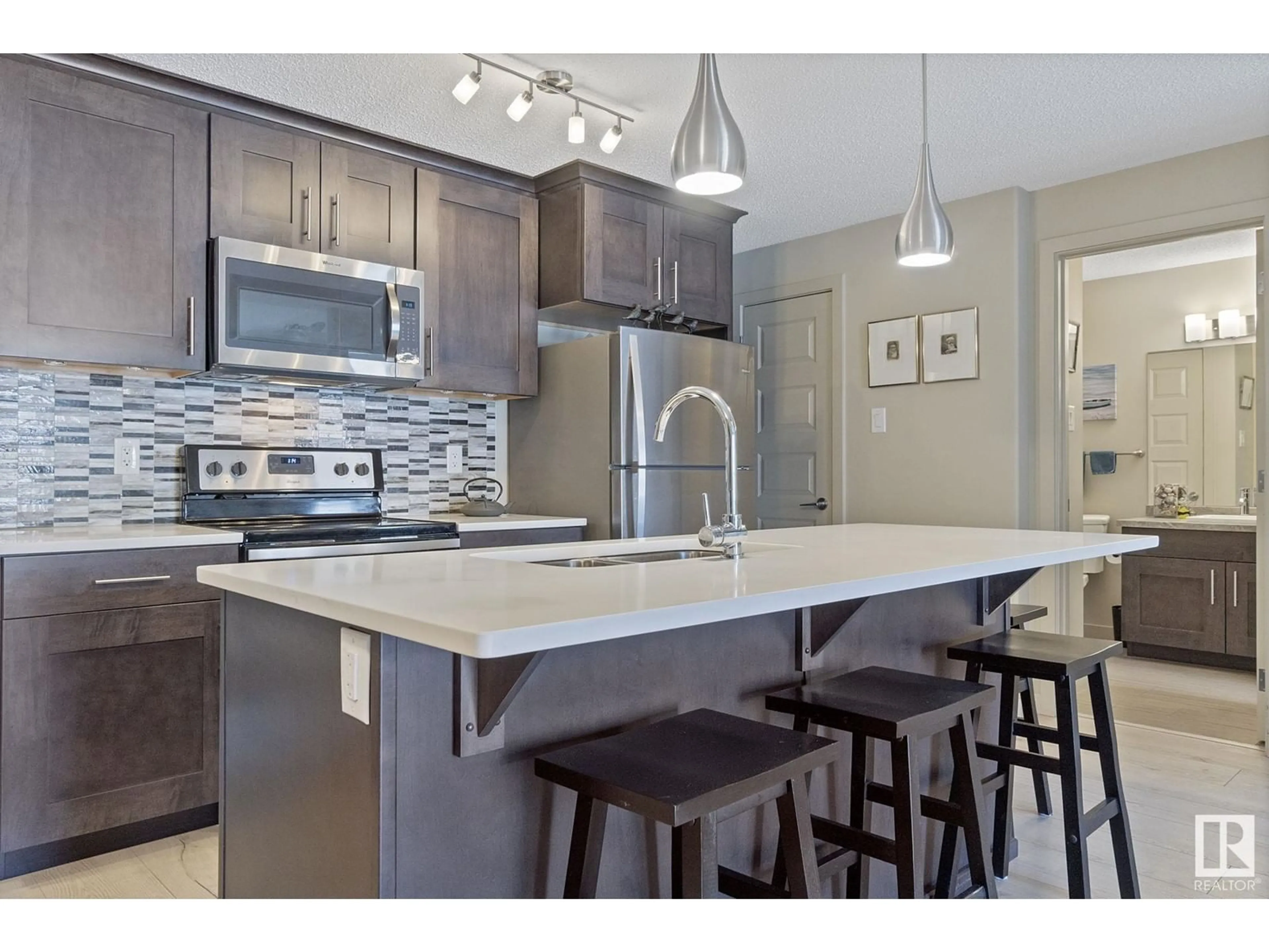 Open concept kitchen, unknown for #305 - 4008 SAVARYN DR, Edmonton Alberta T6X2E5