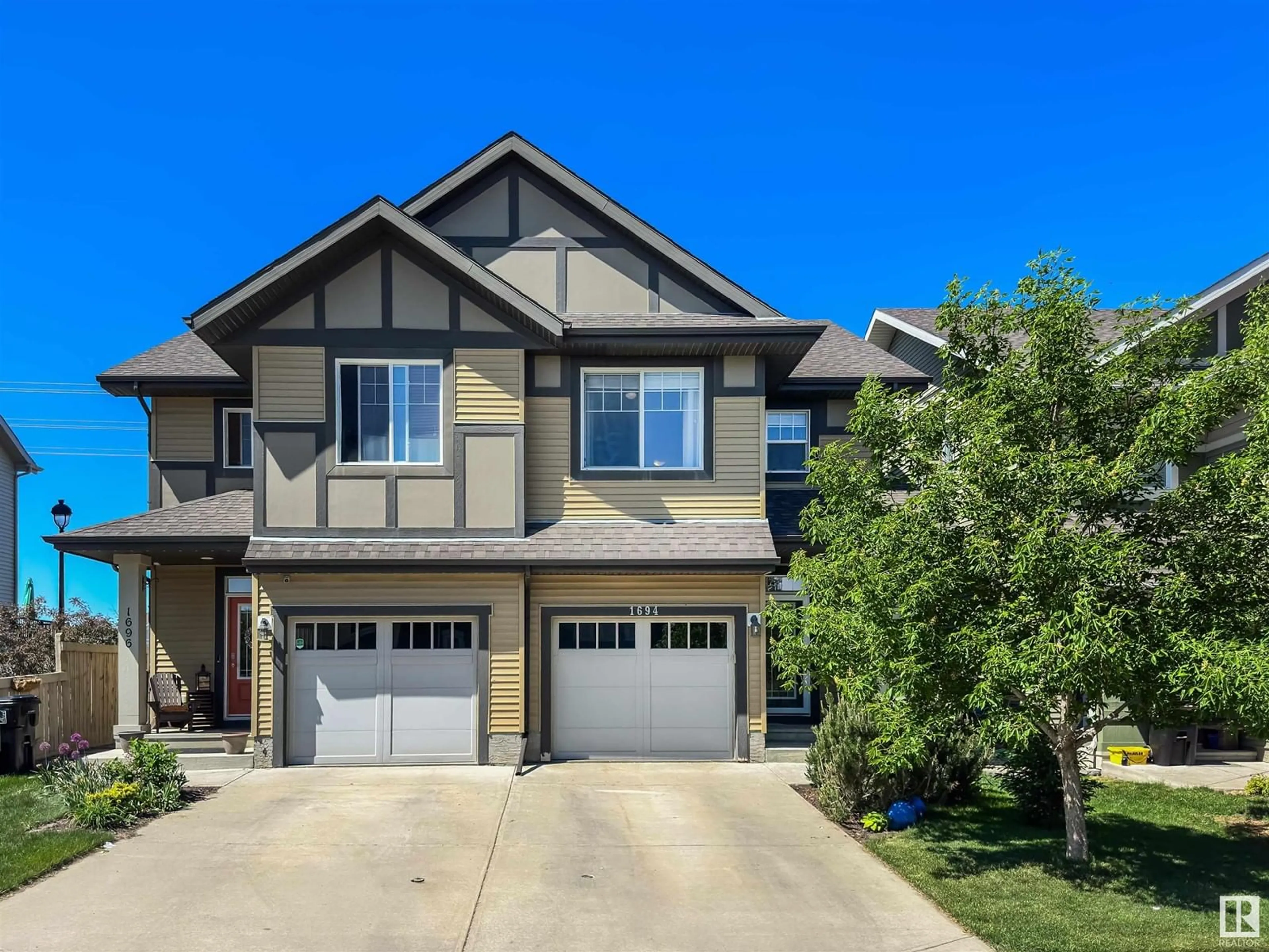 Home with vinyl exterior material, street for 1694 CHAPMAN WY, Edmonton Alberta T6W0Y6