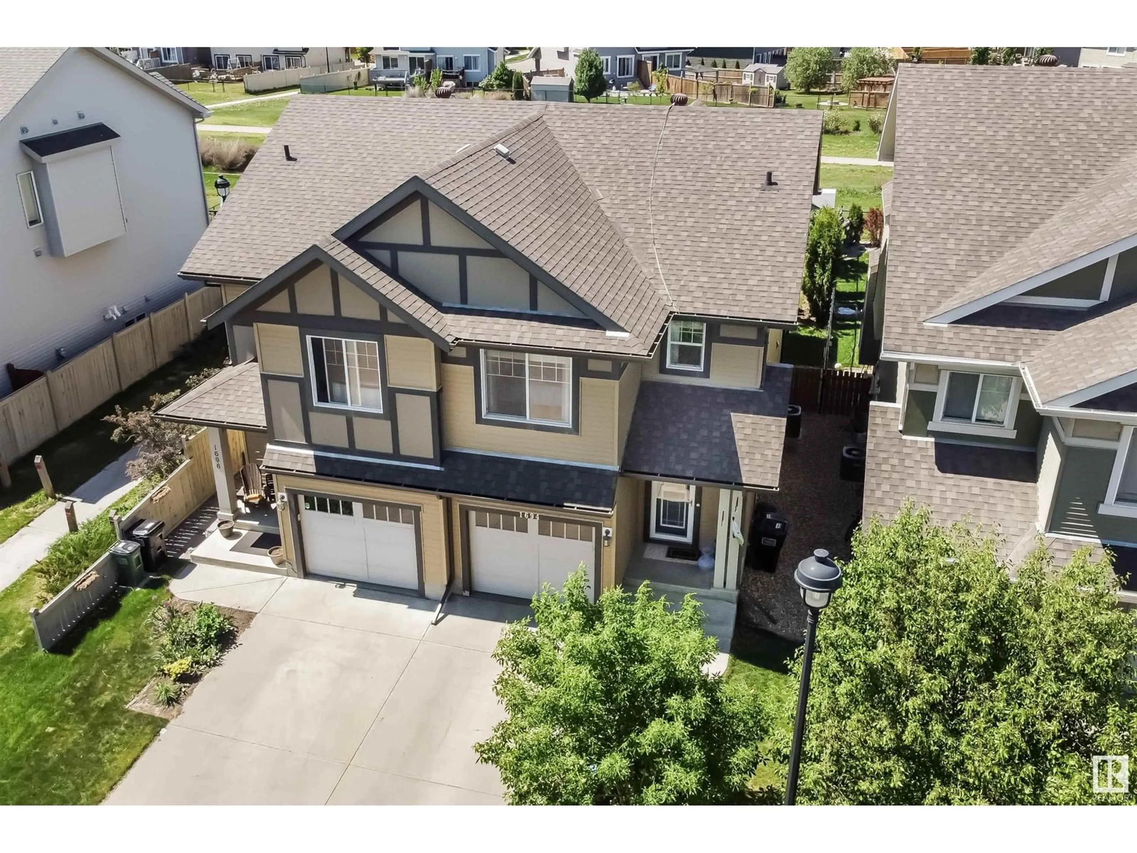A pic from outside/outdoor area/front of a property/back of a property/a pic from drone, street for 1694 CHAPMAN WY, Edmonton Alberta T6W0Y6