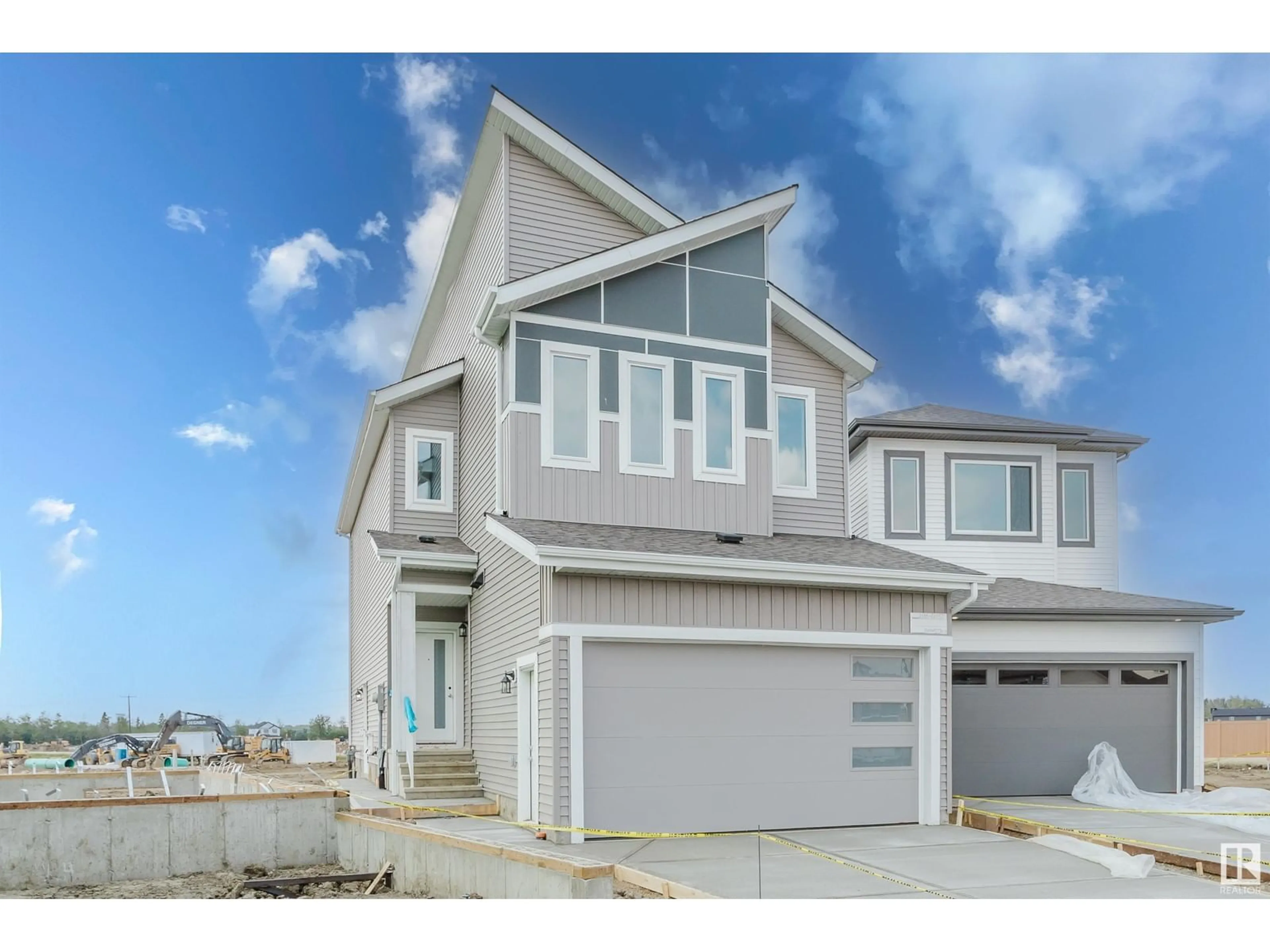 Home with vinyl exterior material, street for NW - 2136 210 ST, Edmonton Alberta T6M3H7