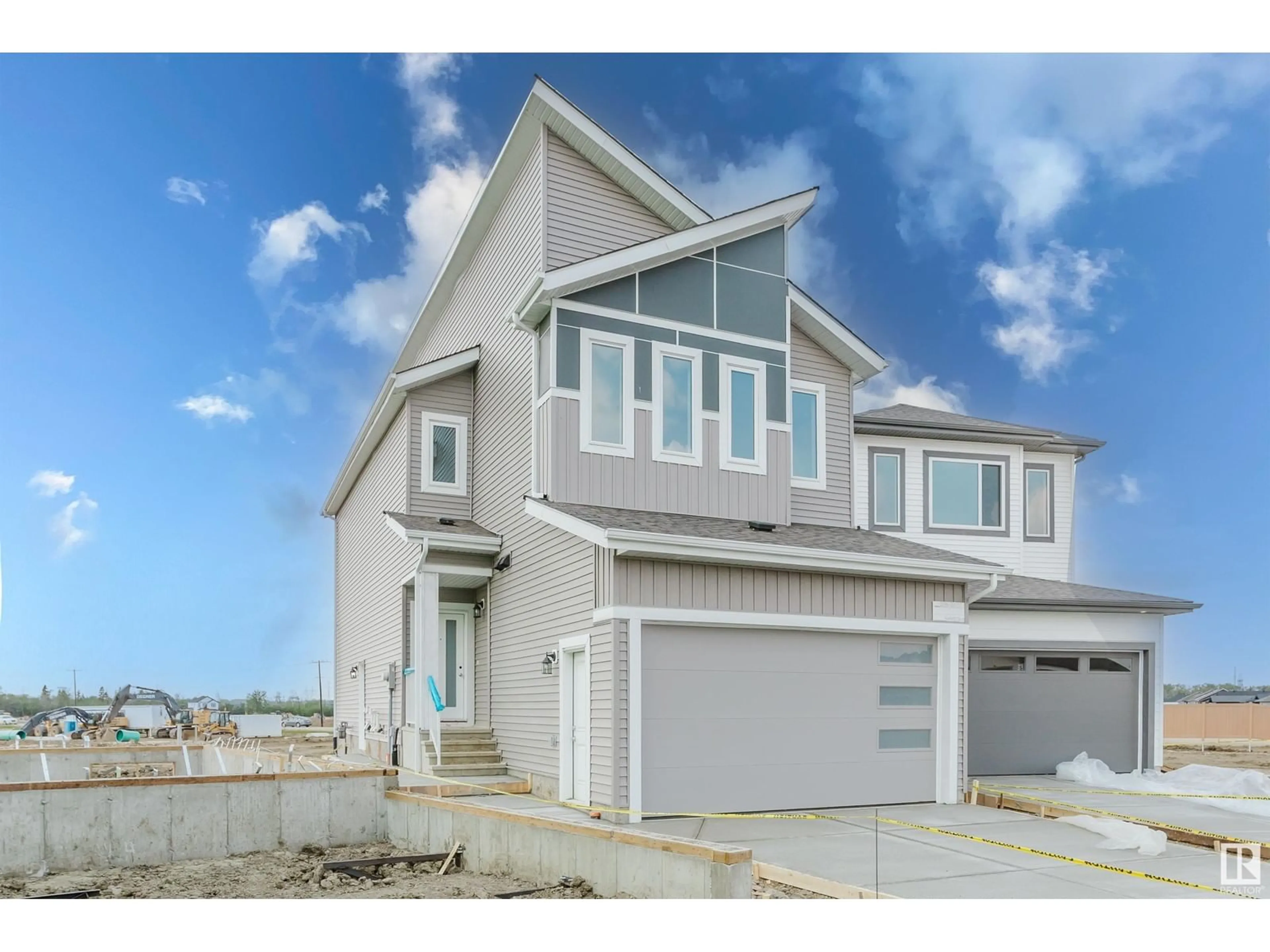 Home with vinyl exterior material, street for NW - 2136 210 ST, Edmonton Alberta T6M3H7