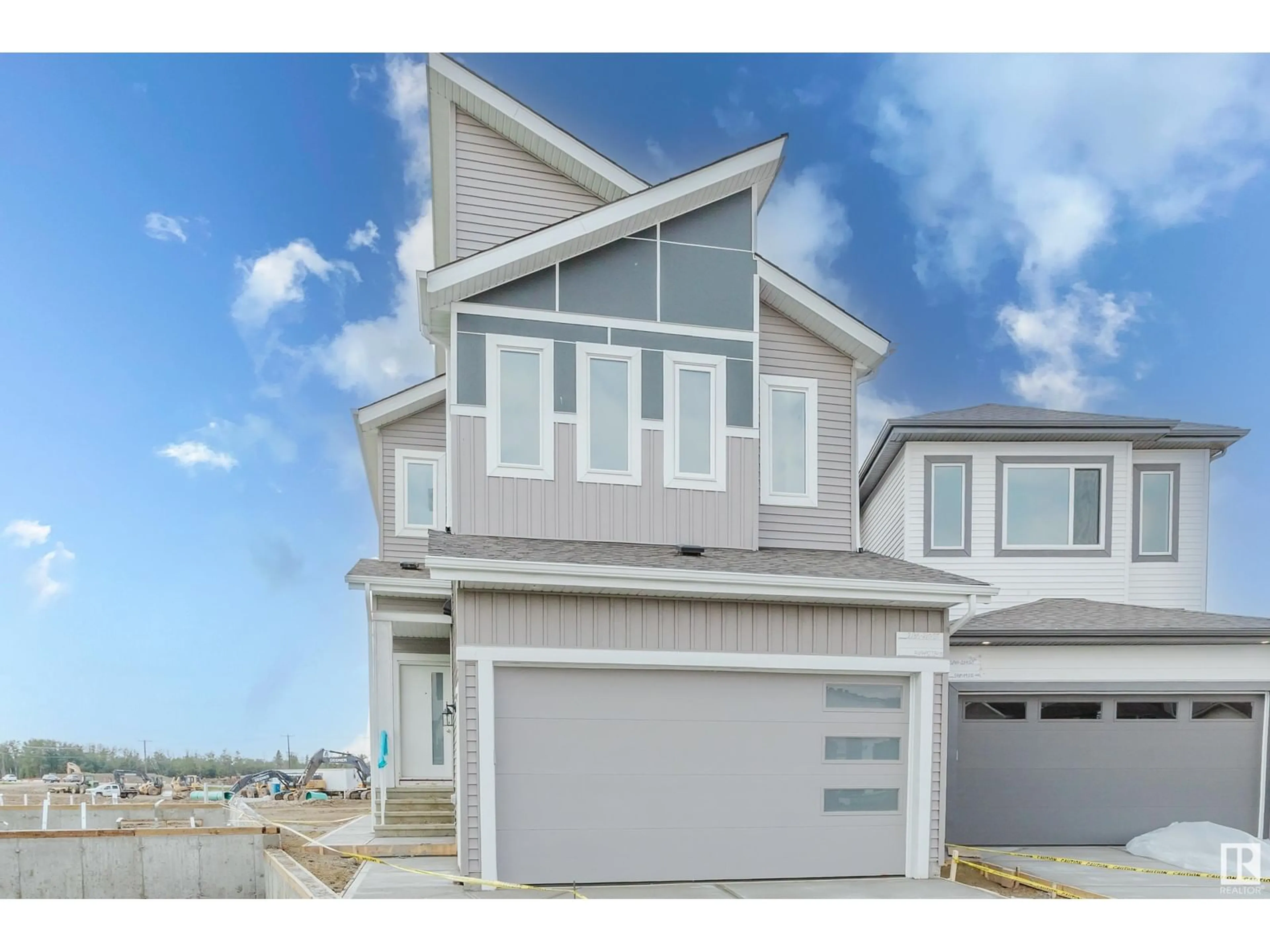 Home with vinyl exterior material, street for NW - 2136 210 ST, Edmonton Alberta T6M3H7