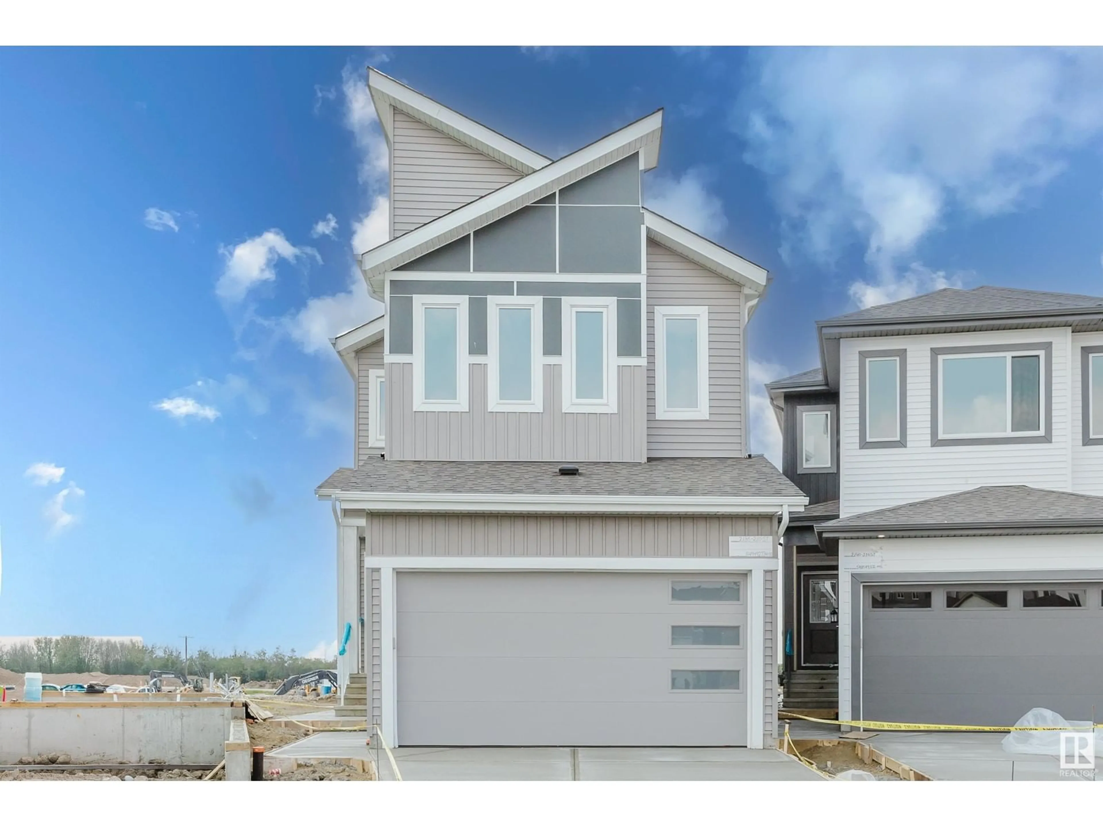 Home with vinyl exterior material, street for NW - 2136 210 ST, Edmonton Alberta T6M3H7