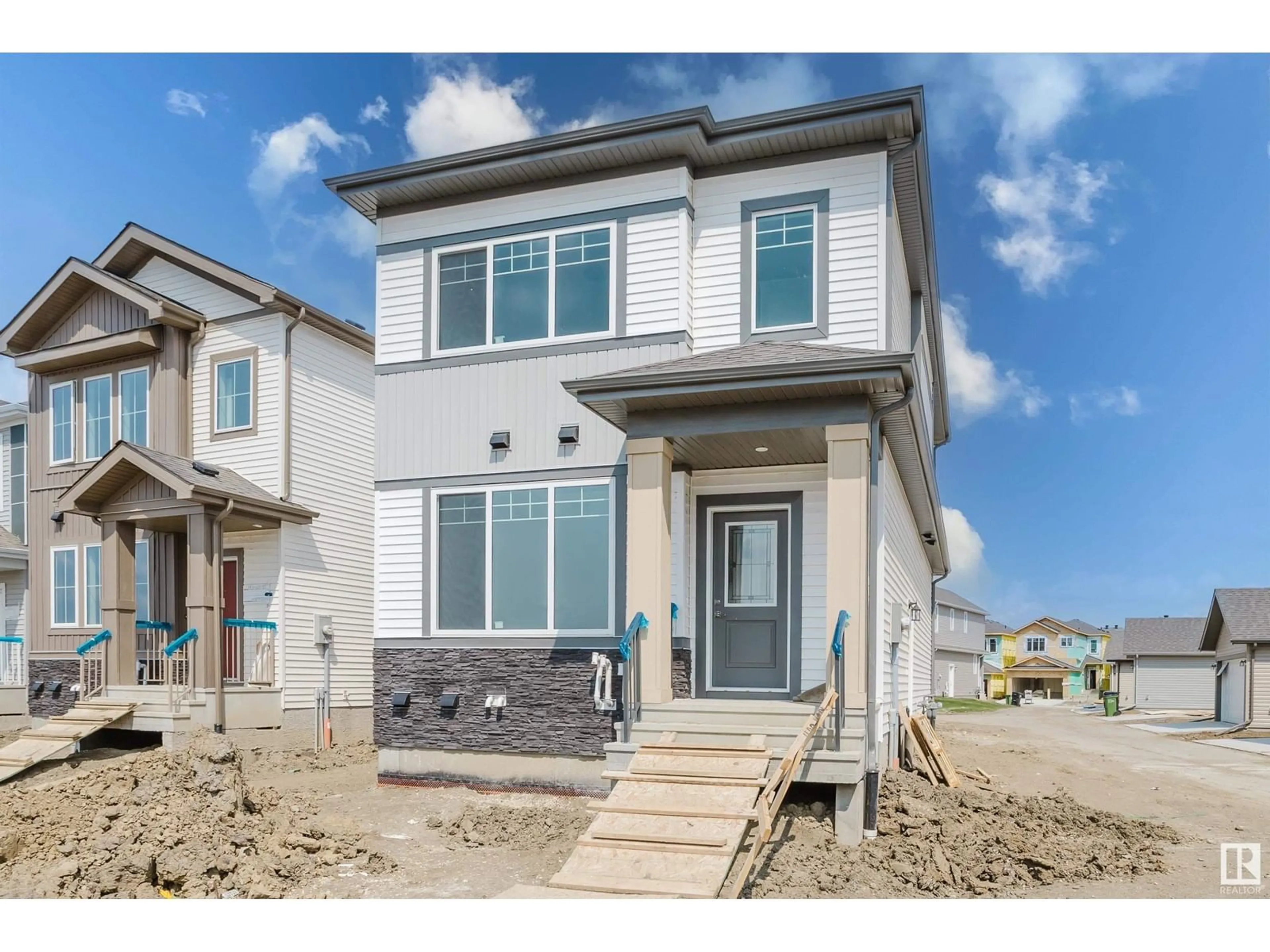 Home with vinyl exterior material, street for 1927 210 ST, Edmonton Alberta T6M3H5
