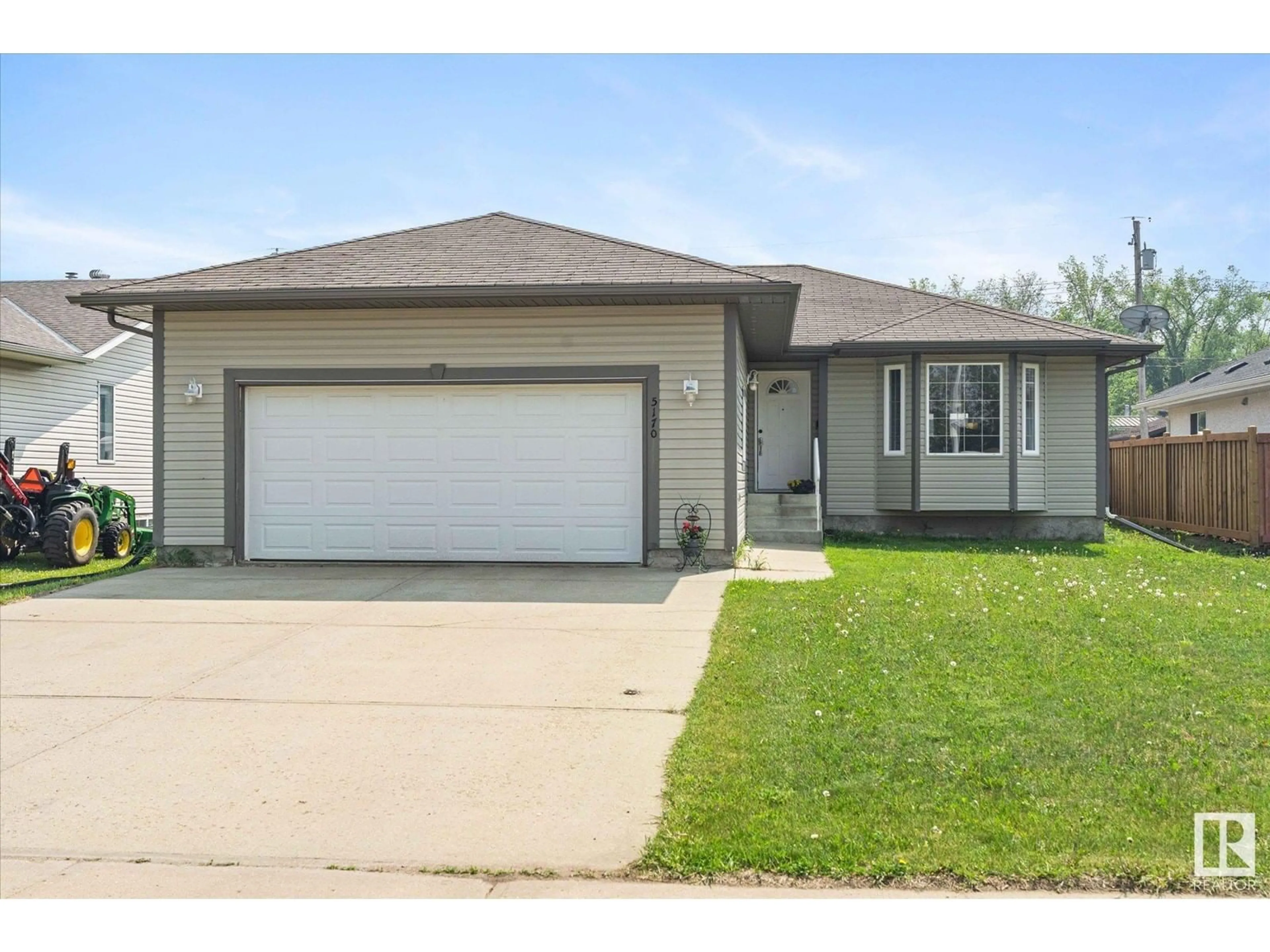 Home with vinyl exterior material, street for 5170 54 AV, Redwater Alberta T0A2W0