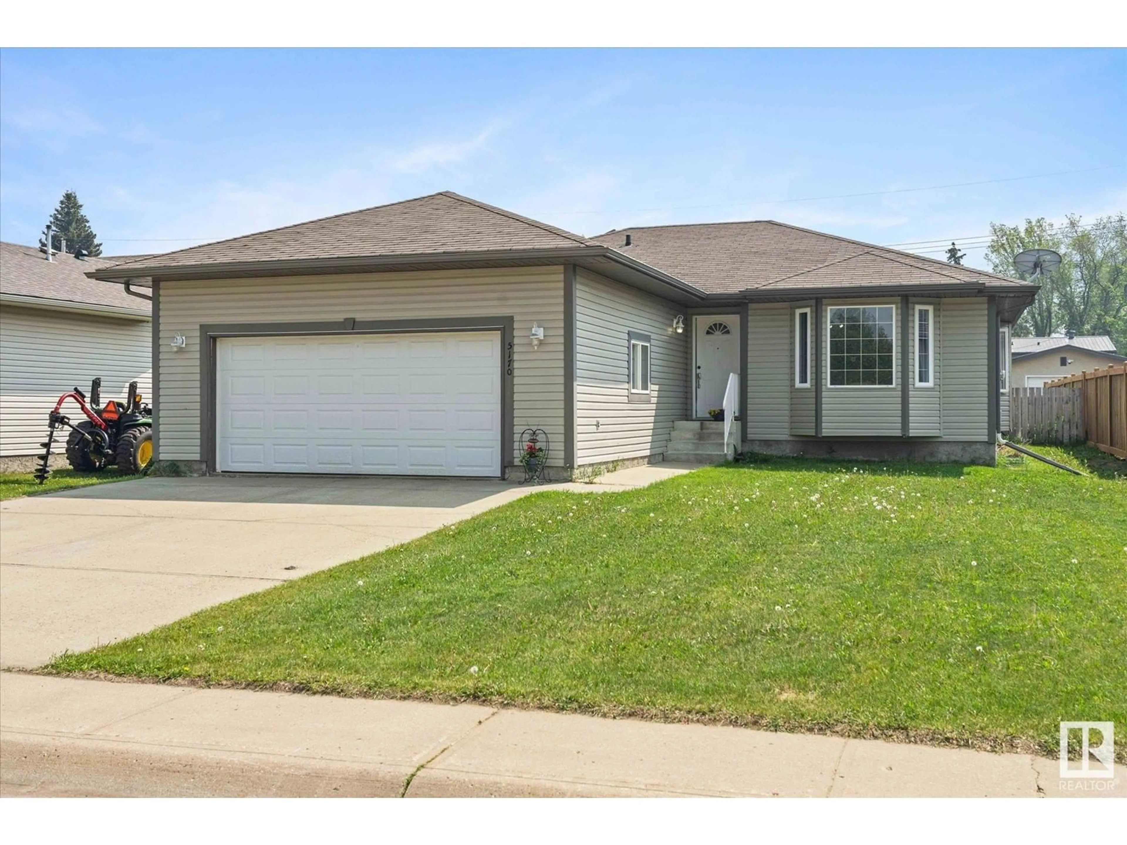 Home with vinyl exterior material, street for 5170 54 AV, Redwater Alberta T0A2W0