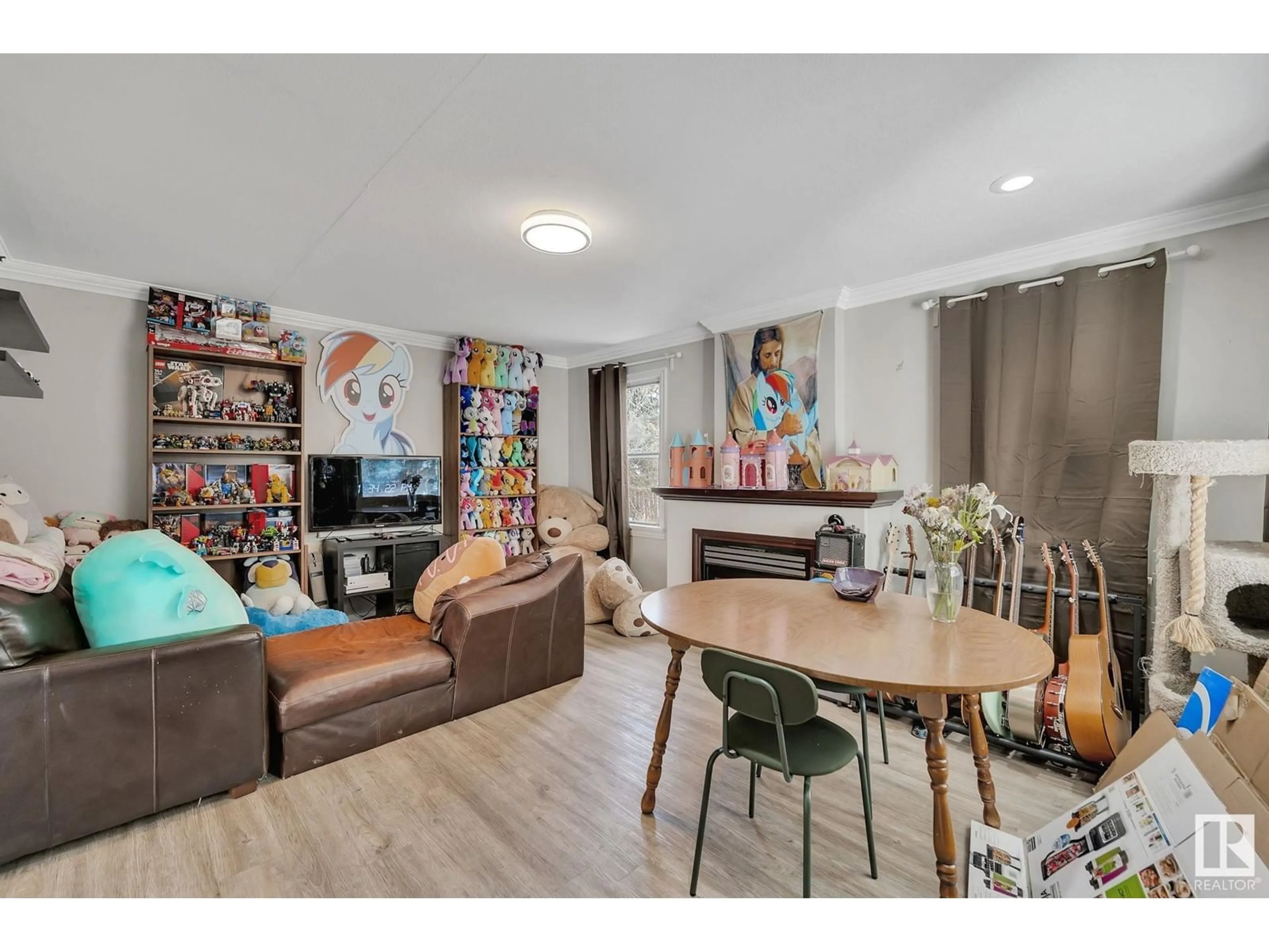 Living room with furniture, wood/laminate floor for NW - 12235 104 ST, Edmonton Alberta T5G2L7