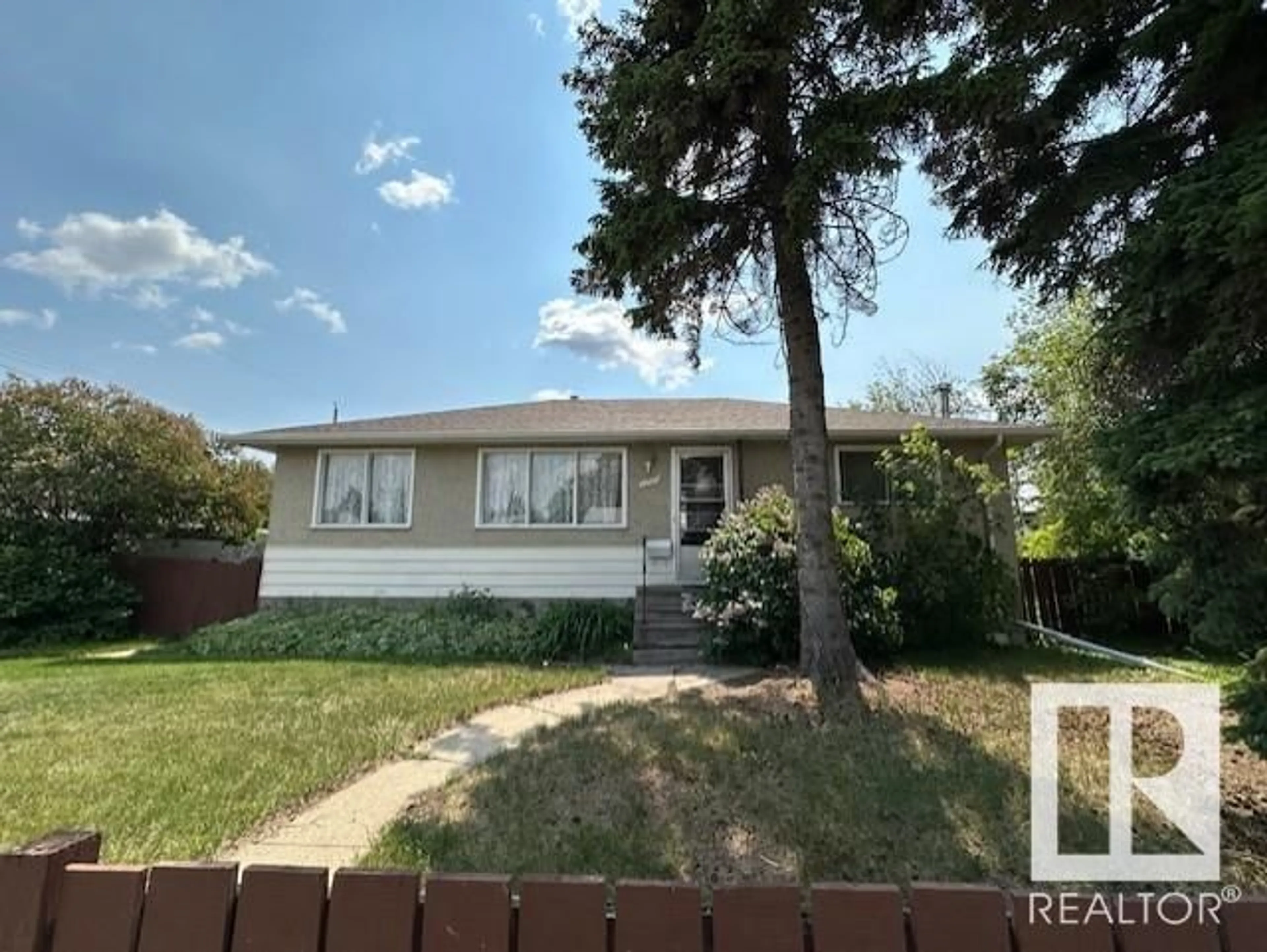 Home with vinyl exterior material, street for 13907 135 AV NW, Edmonton Alberta T5L3Z1