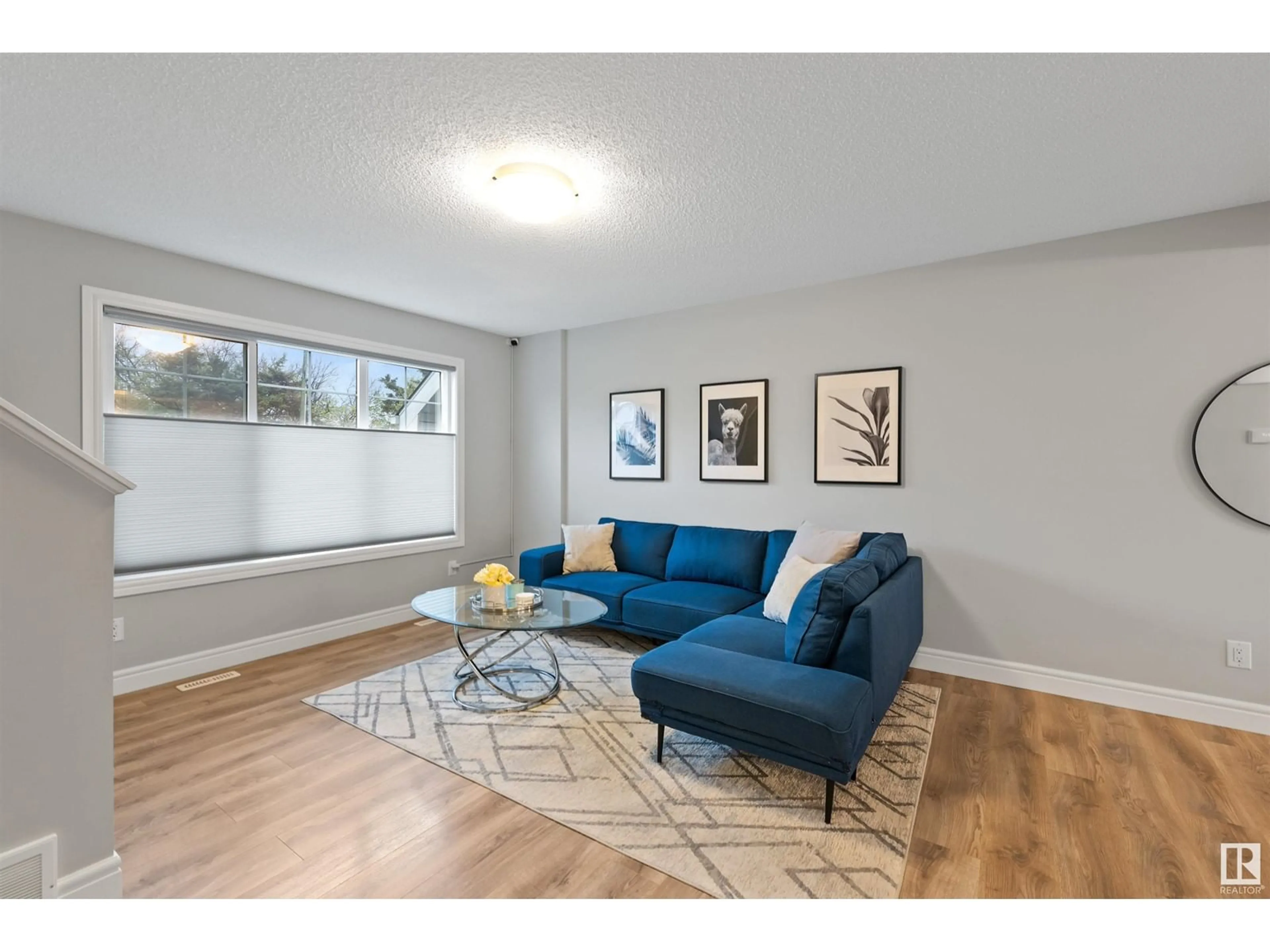 Living room with furniture, wood/laminate floor for #30 - 1391 STARLING DR, Edmonton Alberta T5S0L3