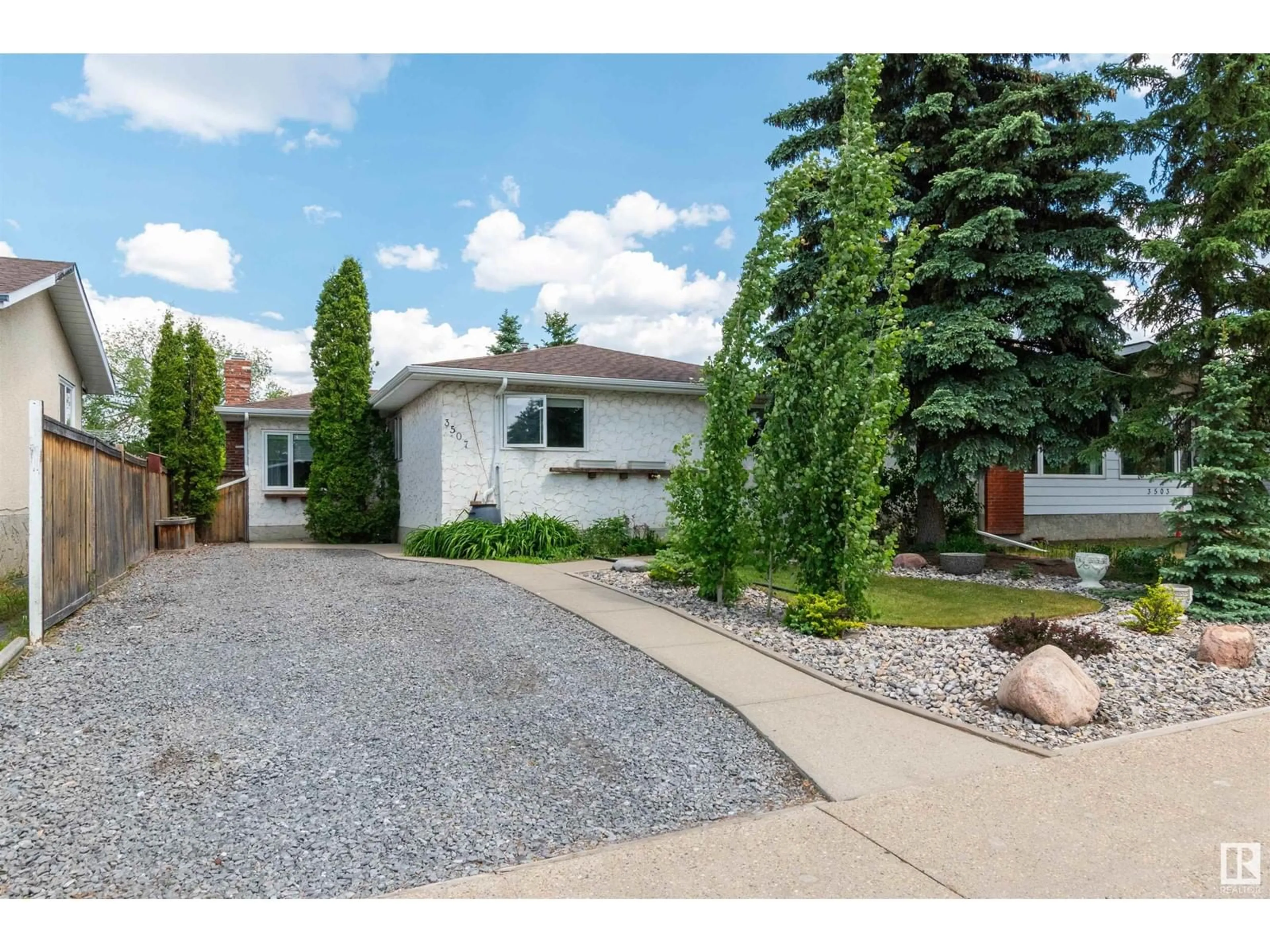 Home with vinyl exterior material, street for 3507 79 ST, Edmonton Alberta T6K0G1