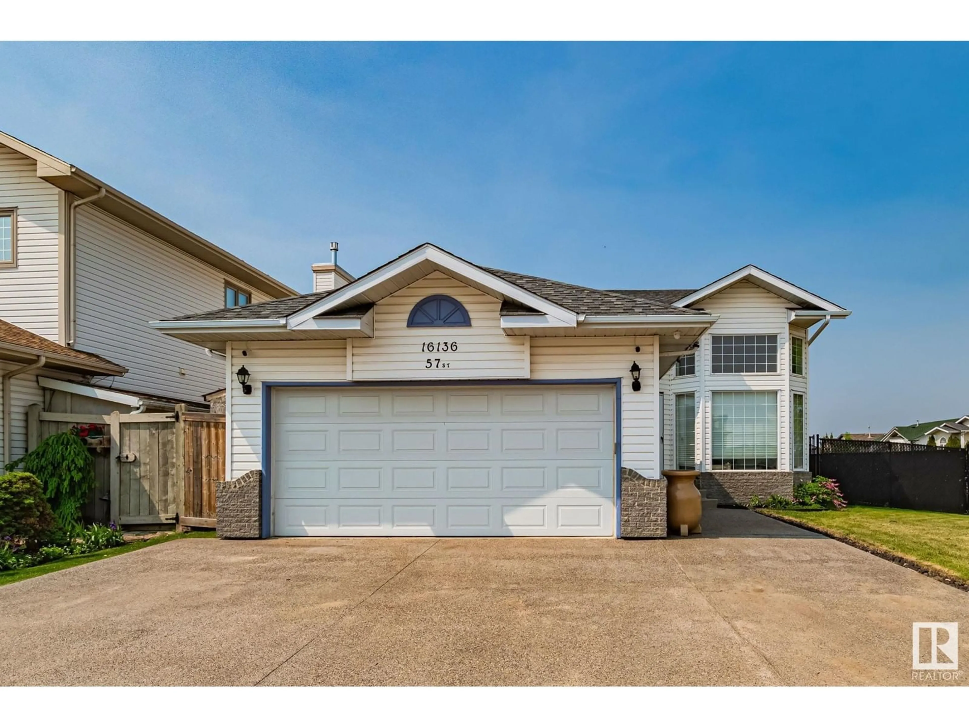 Home with vinyl exterior material, street for NW - 16136 57 ST, Edmonton Alberta T5Y2T1