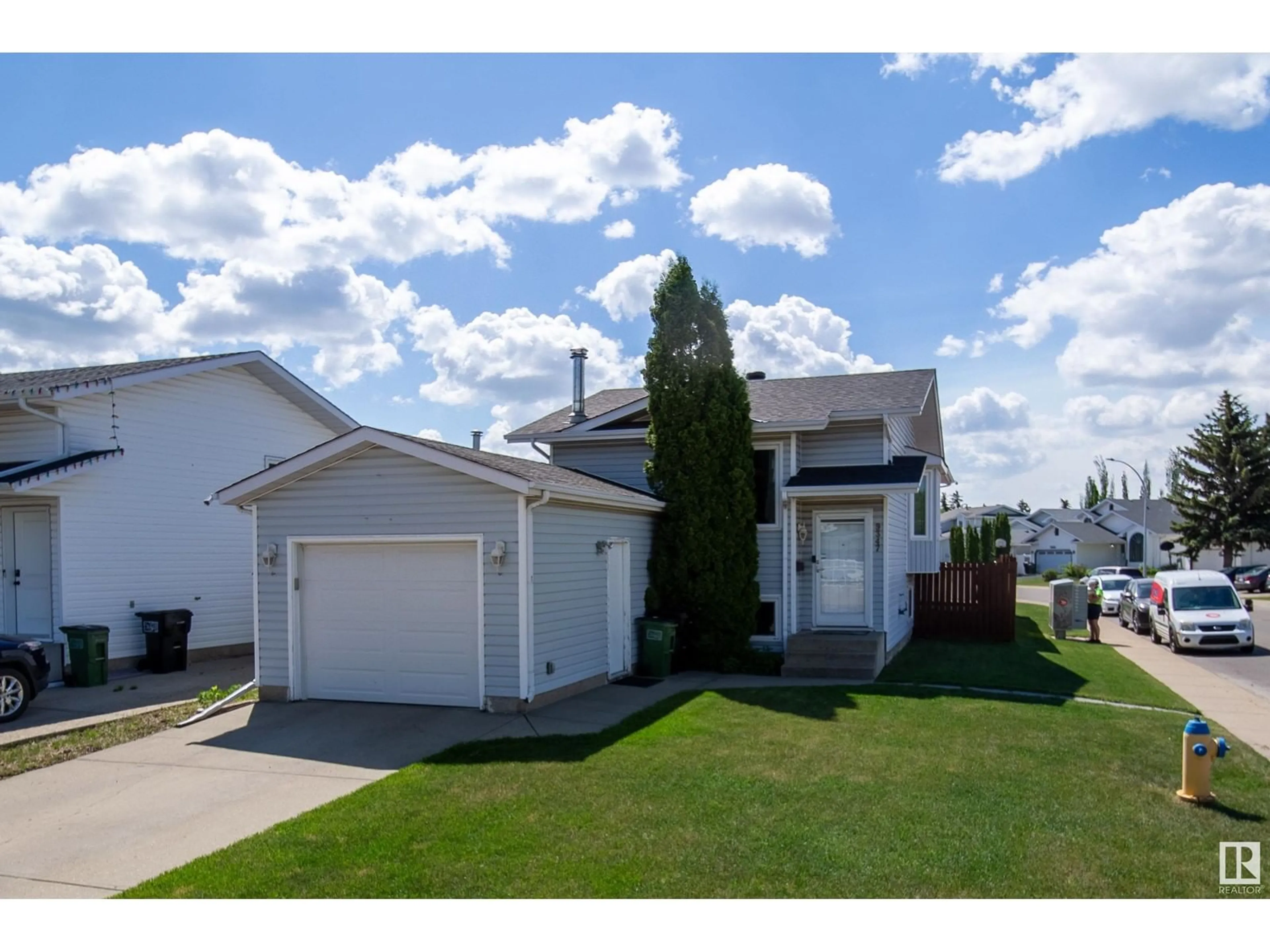 Home with vinyl exterior material, street for 9347 180A AV, Edmonton Alberta T5Z2J4