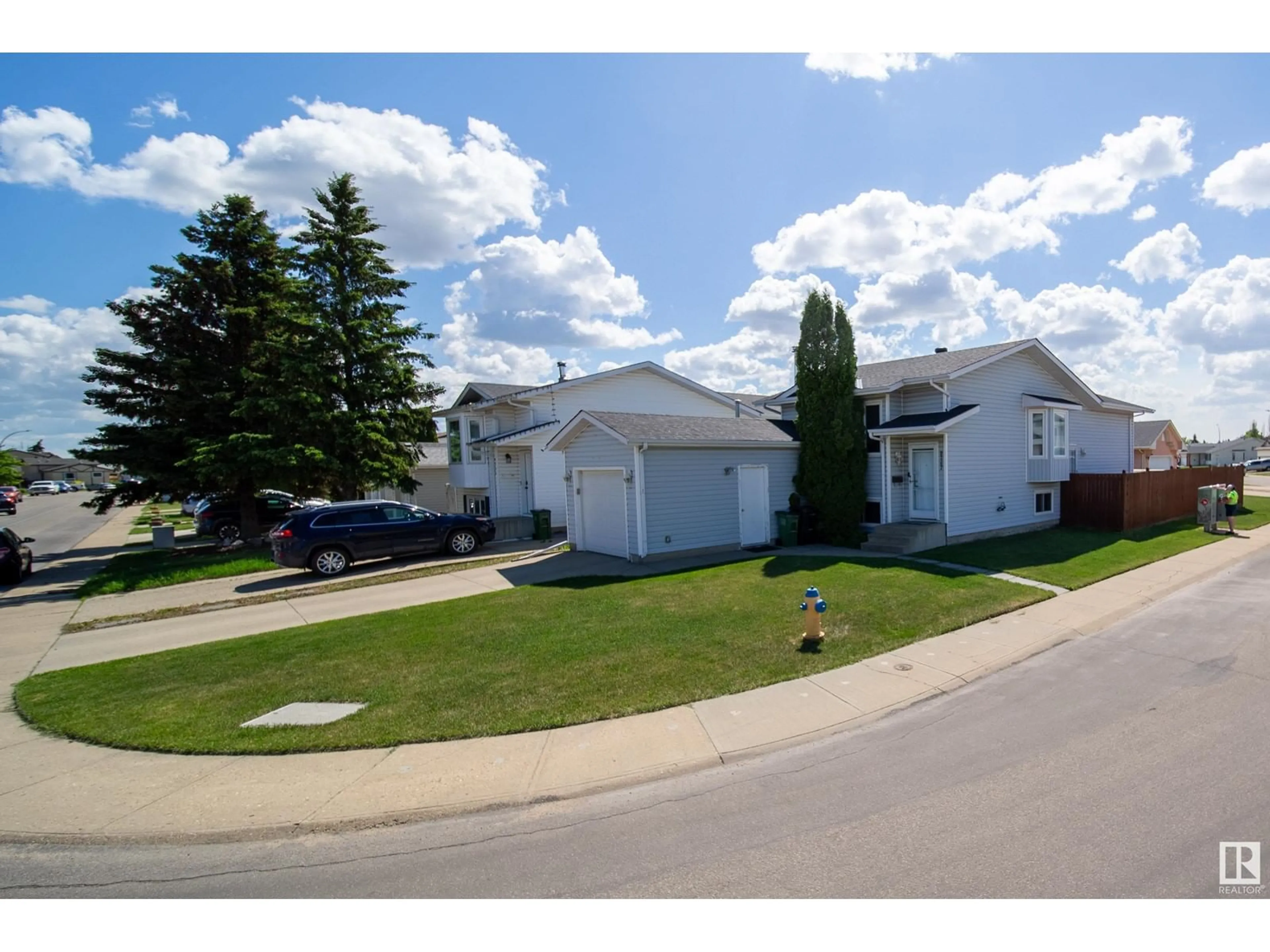 Home with vinyl exterior material, street for 9347 180A AV, Edmonton Alberta T5Z2J4