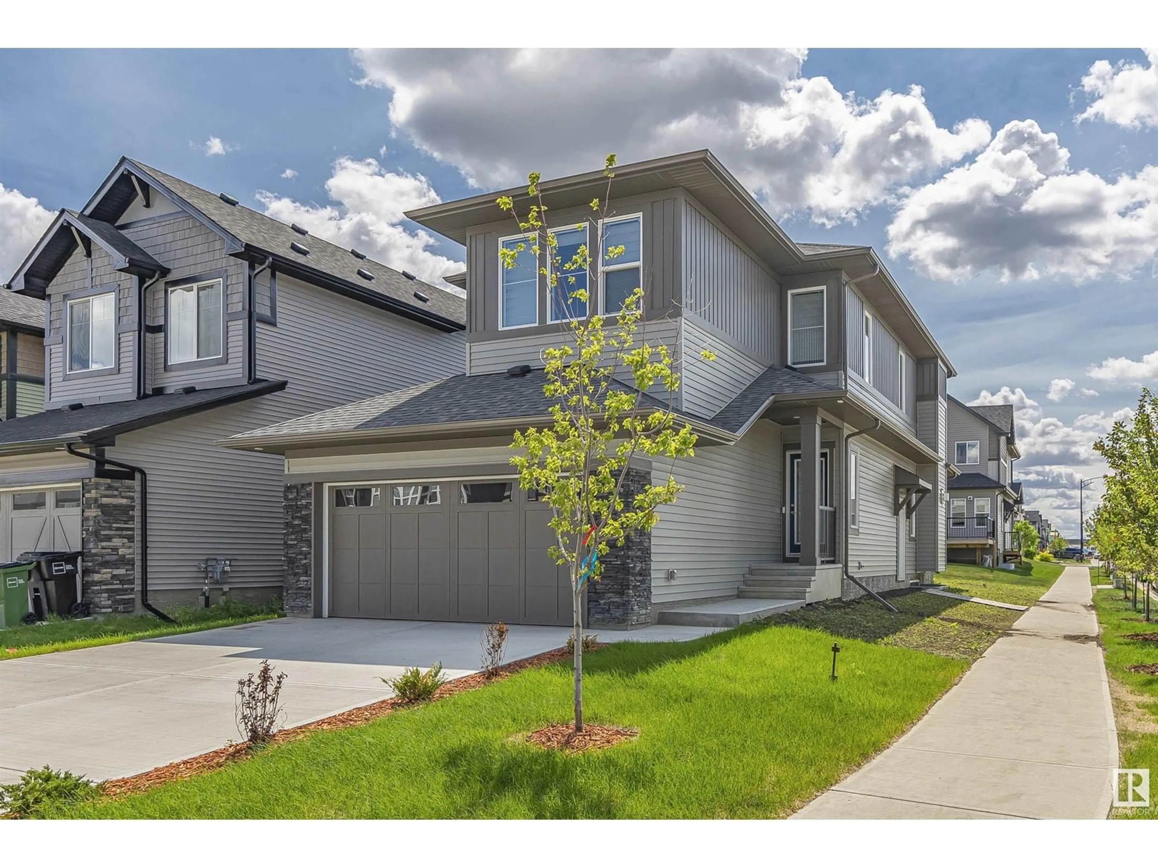 Home with vinyl exterior material, street for 4825 KINNEY RD, Edmonton Alberta T6W5G2