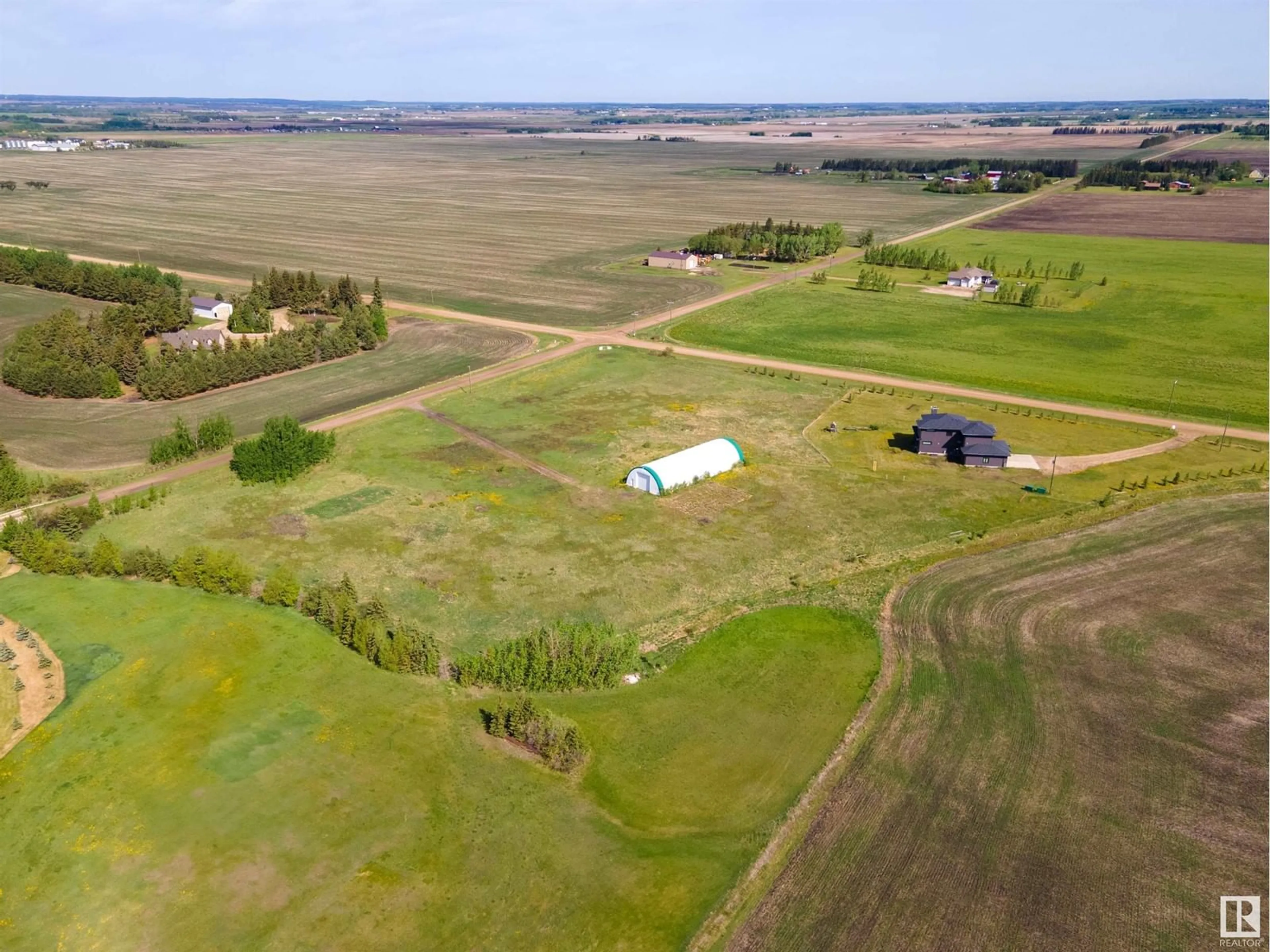 A pic from outside/outdoor area/front of a property/back of a property/a pic from drone, unknown for 26231 TWP RD 544, Rural Sturgeon County Alberta T8T1N3