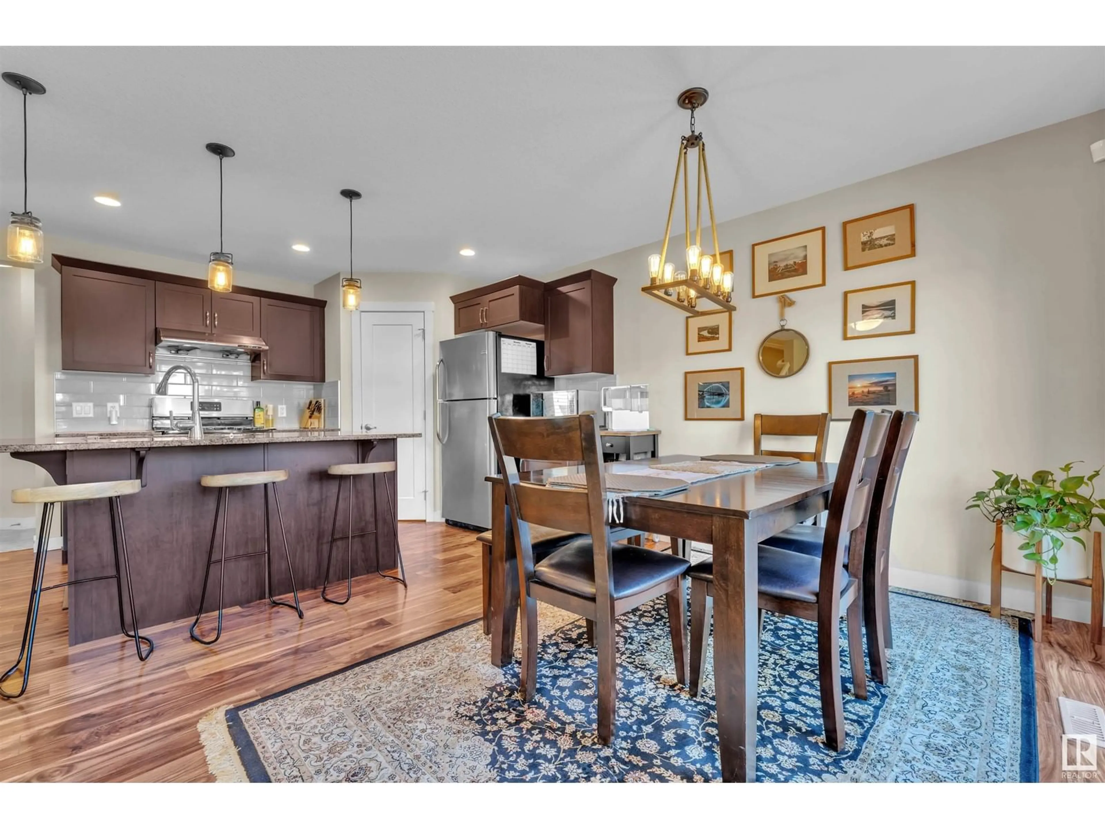 Open concept kitchen, wood/laminate floor for 20212 43 AV, Edmonton Alberta T6M0R8