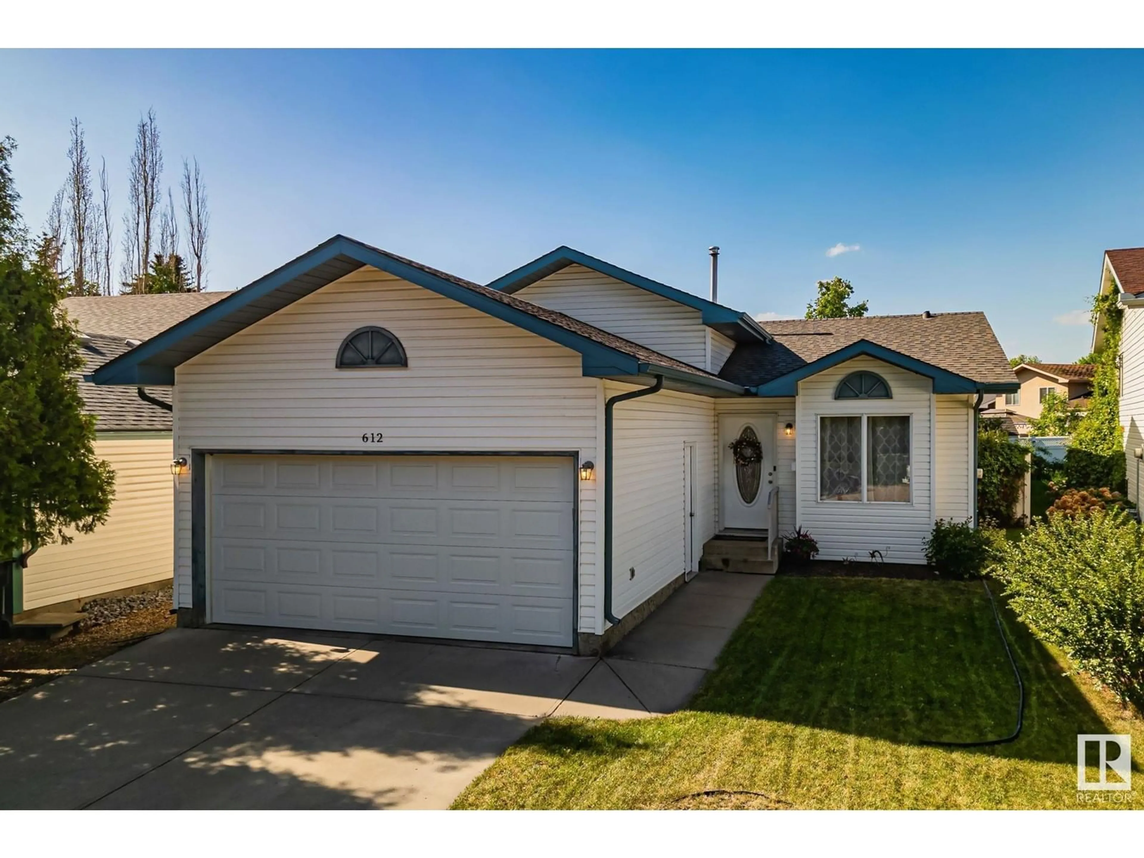 Home with vinyl exterior material, street for 612 HORNER RD, Edmonton Alberta T5A4Y9
