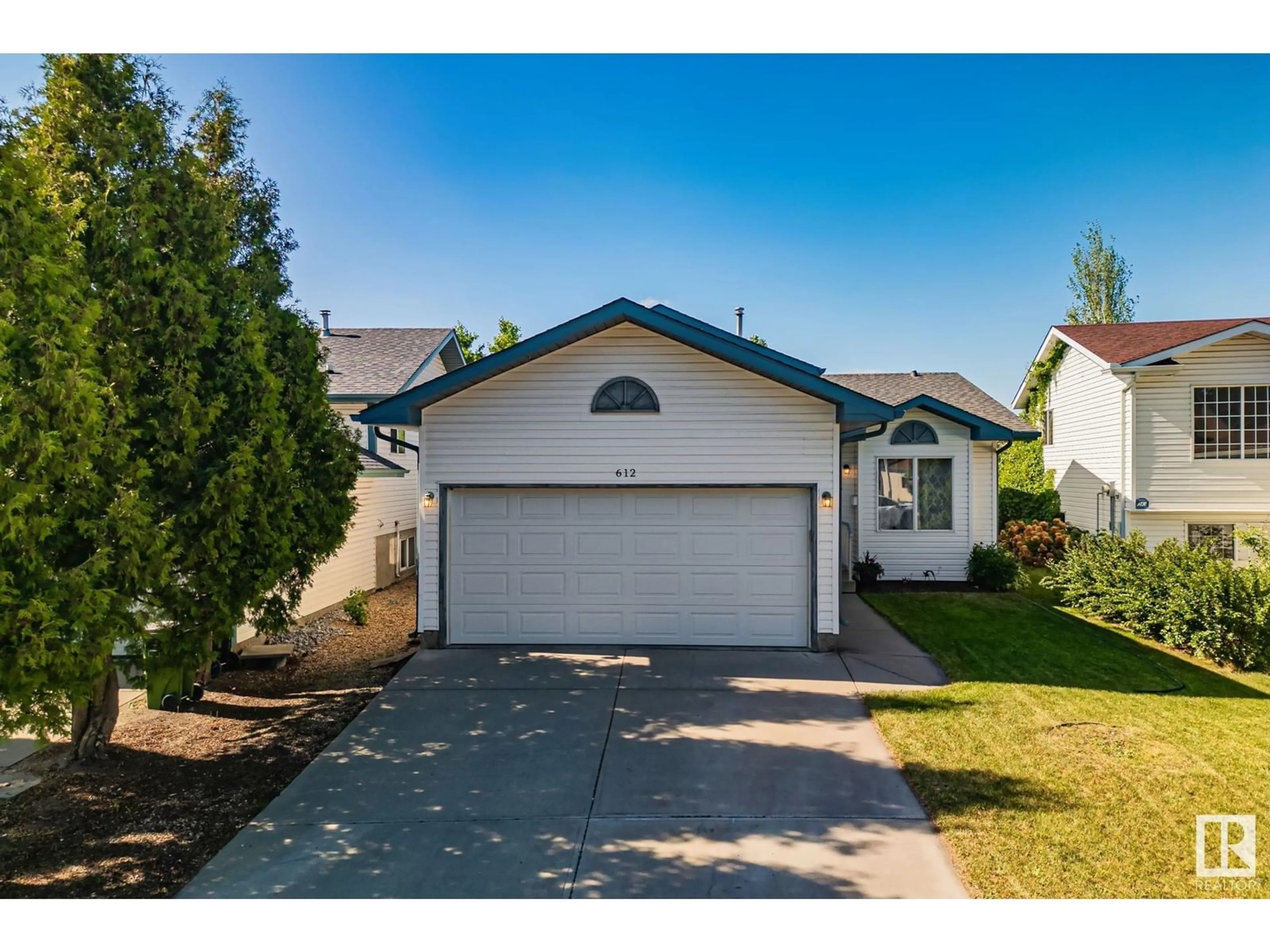 Home with vinyl exterior material, street for 612 HORNER RD, Edmonton Alberta T5A4Y9