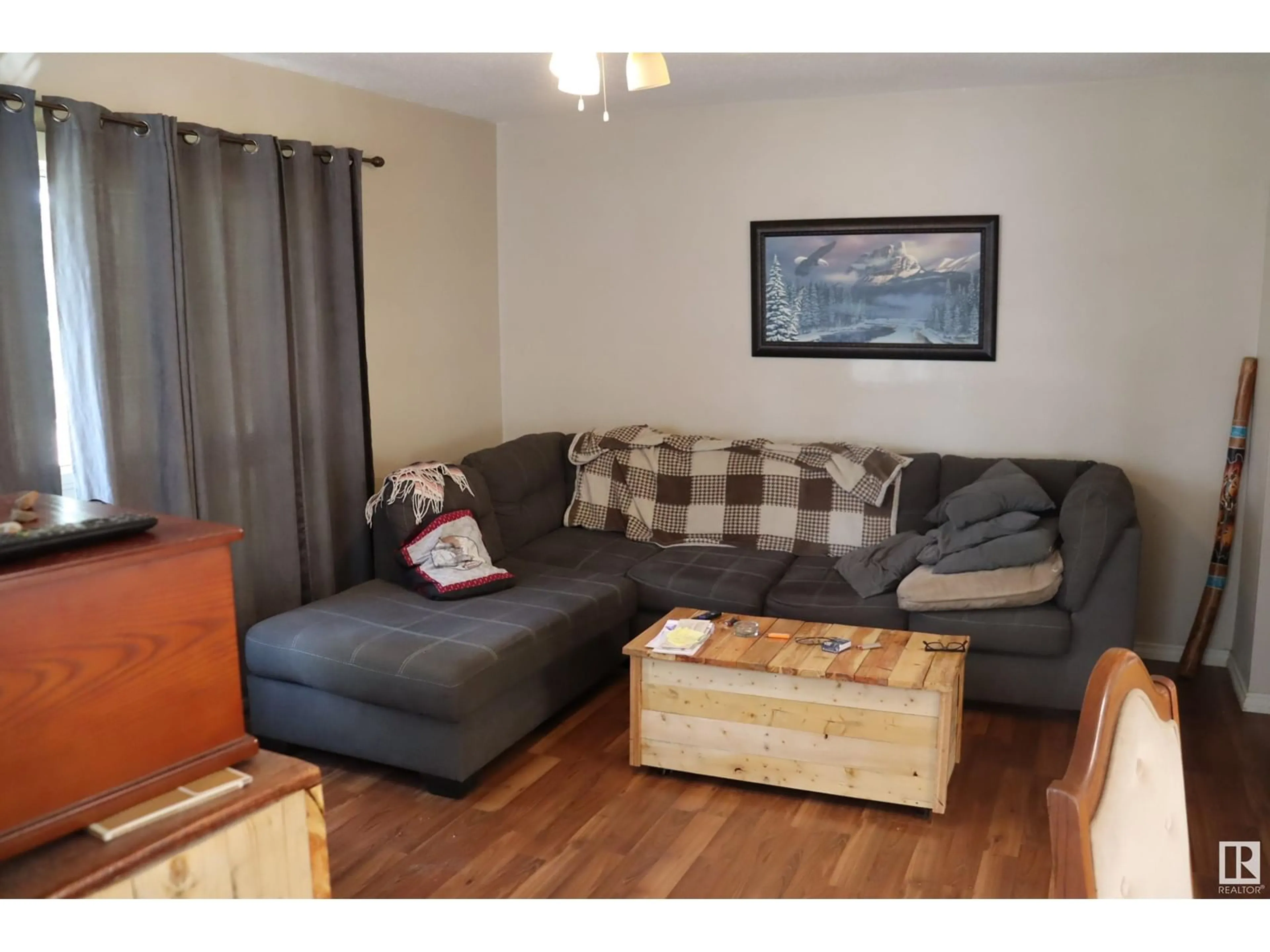Living room with furniture, wood/laminate floor for 5319 47 AV, Wetaskiwin Alberta T9A0K9