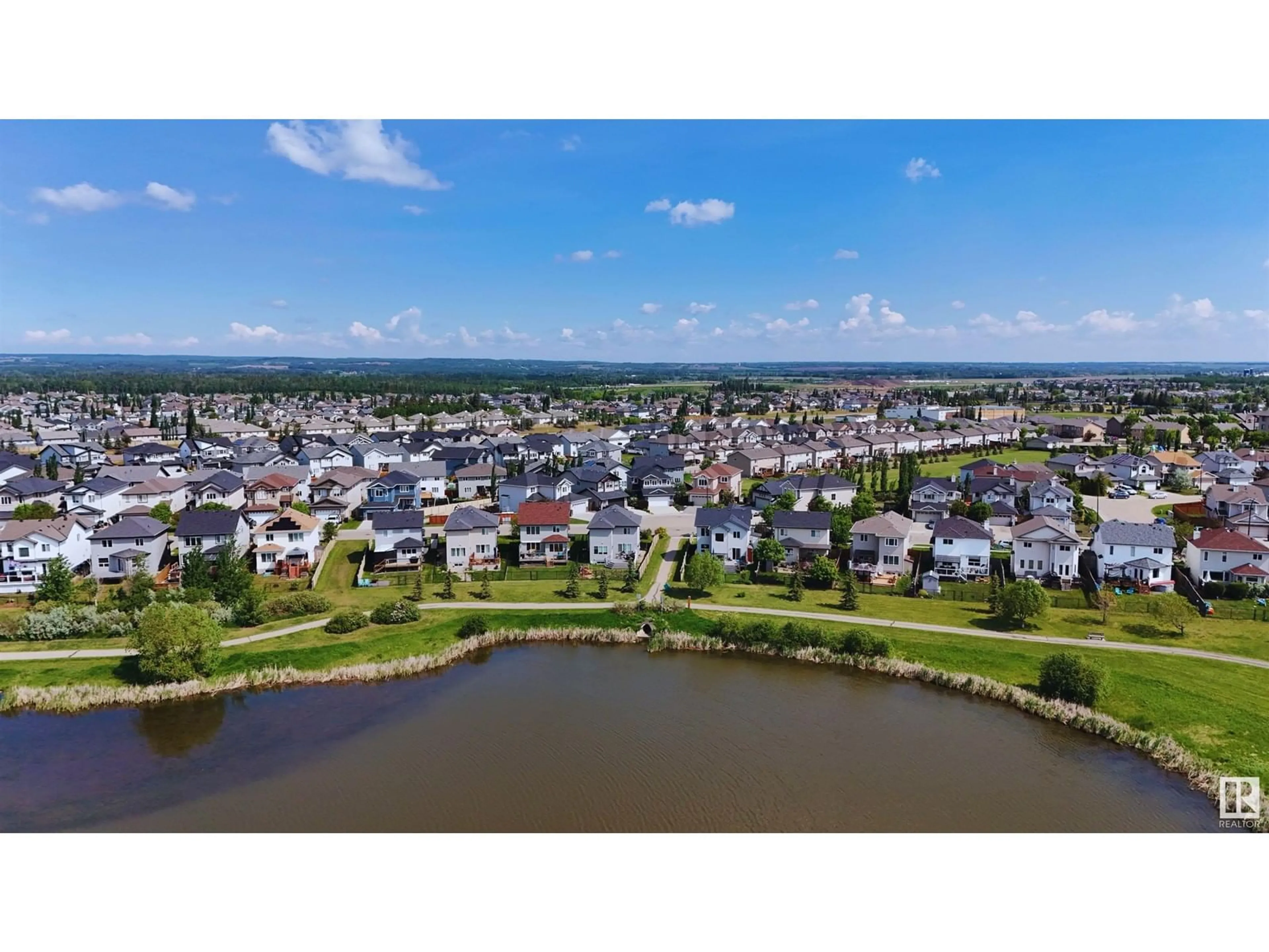A pic from outside/outdoor area/front of a property/back of a property/a pic from drone, water/lake/river/ocean view for 49 SPRUCE RIDGE DR, Spruce Grove Alberta T7X4M8