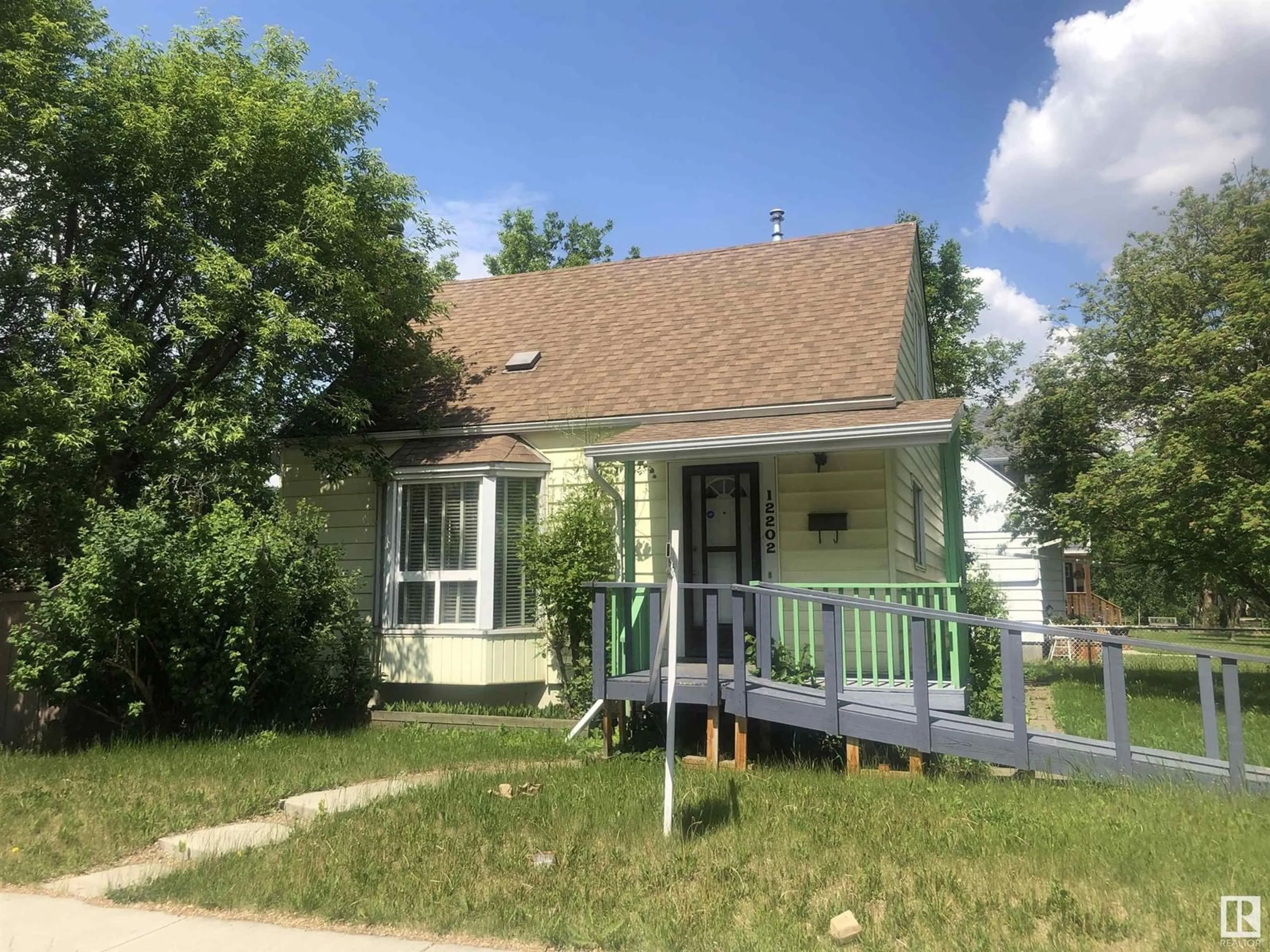 Home with vinyl exterior material, street for NW - 12202 105 ST, Edmonton Alberta T5G2N8