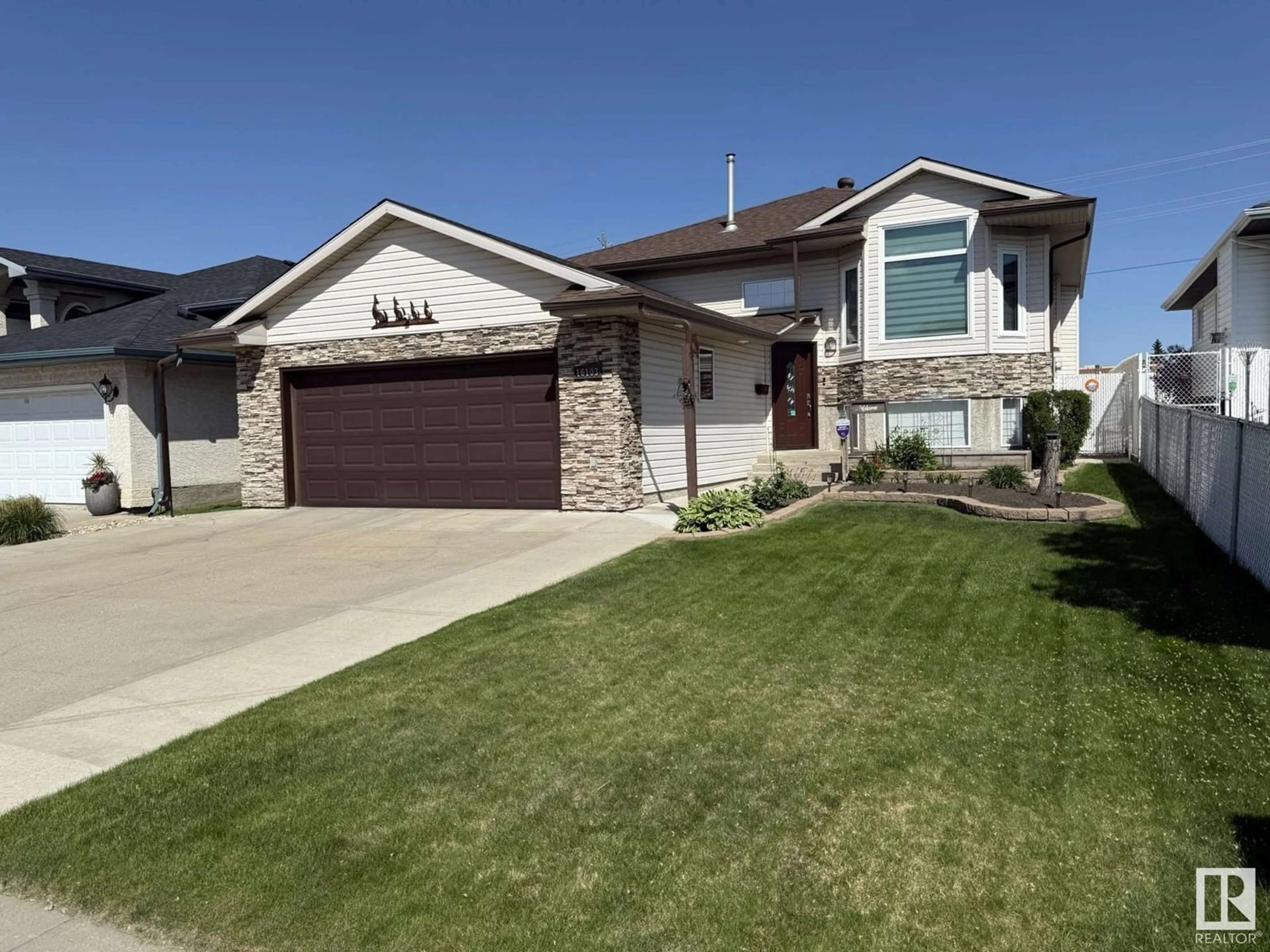 Home with vinyl exterior material, street for NW - 16103 67 ST, Edmonton Alberta T5Z3C5