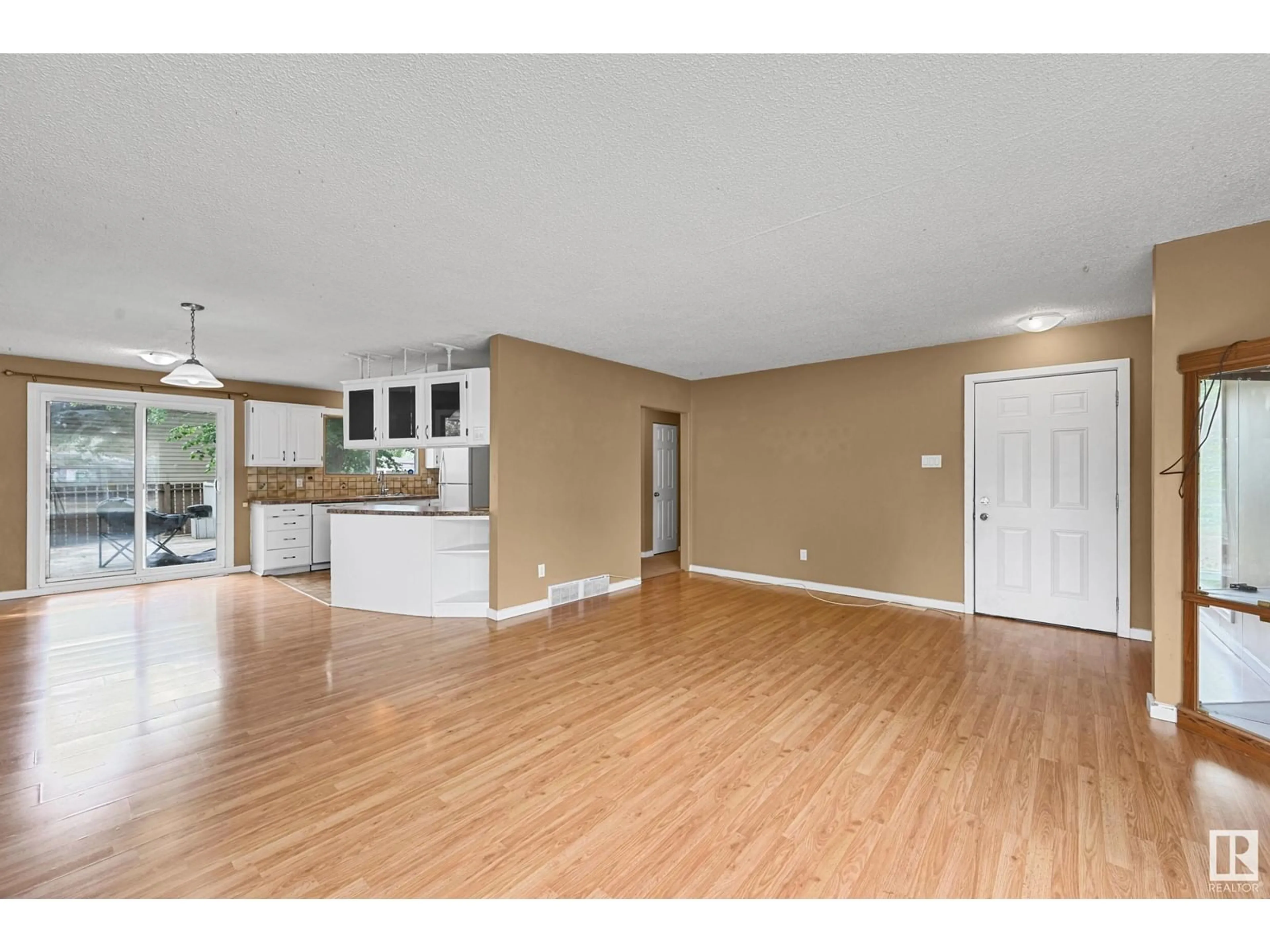 Open concept kitchen, wood/laminate floor for 8320 154 ST, Edmonton Alberta T5R1S4