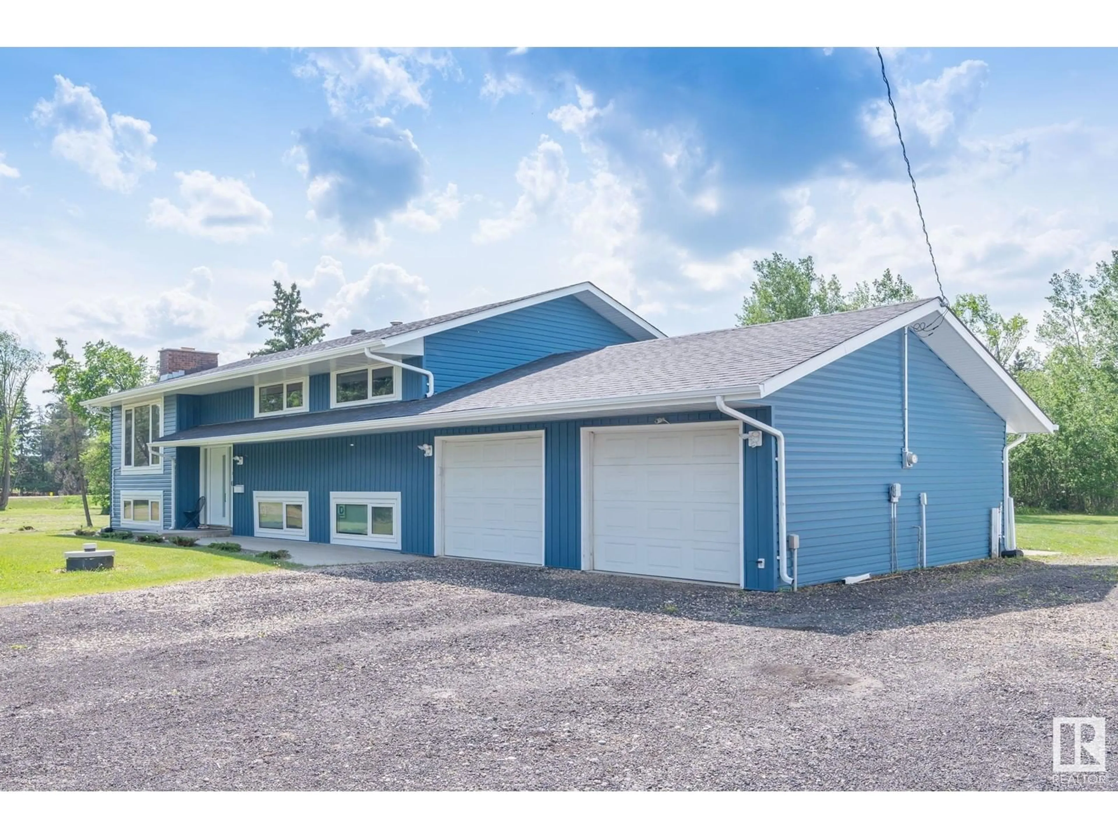 Home with vinyl exterior material, street for 253 22550 TWP RD 522, Rural Strathcona County Alberta T8B1G8