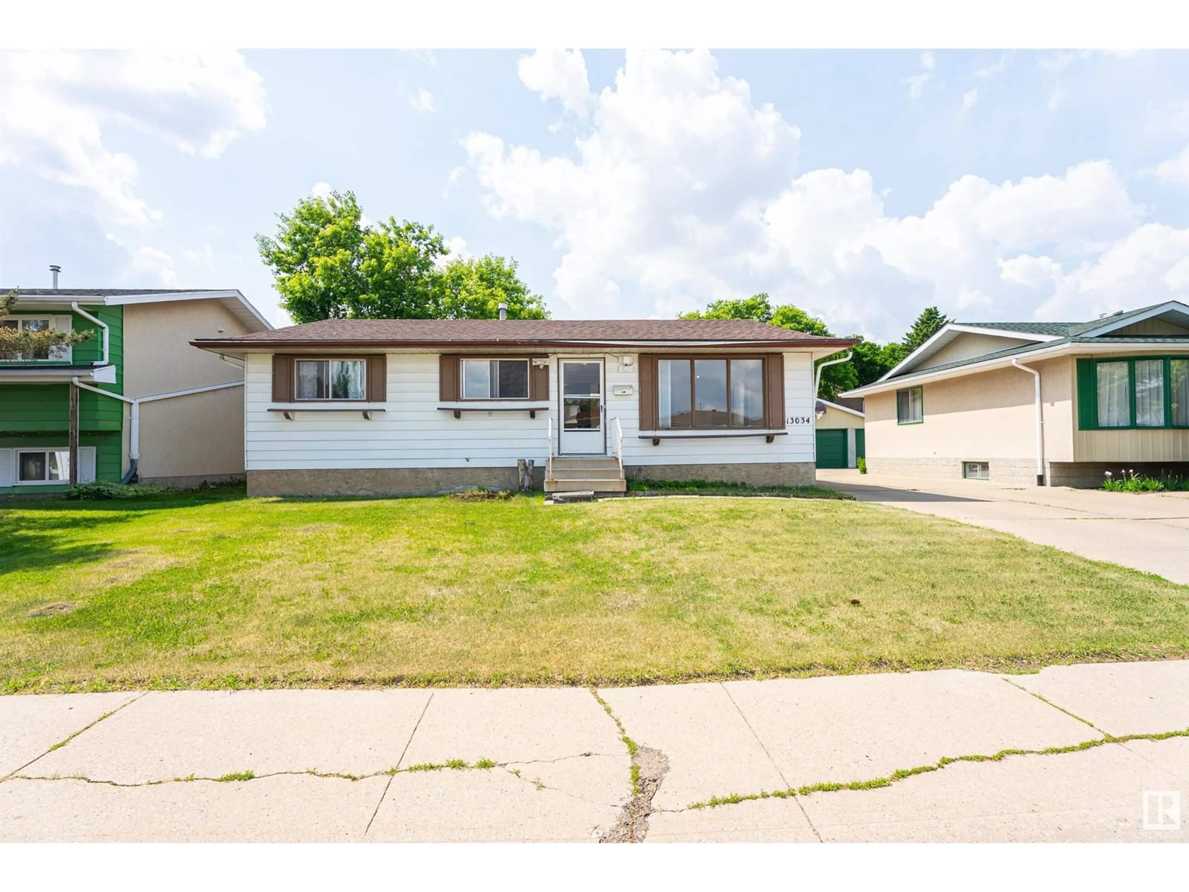 Home with vinyl exterior material, street for NW - 13034 32A ST, Edmonton Alberta T5A3E5
