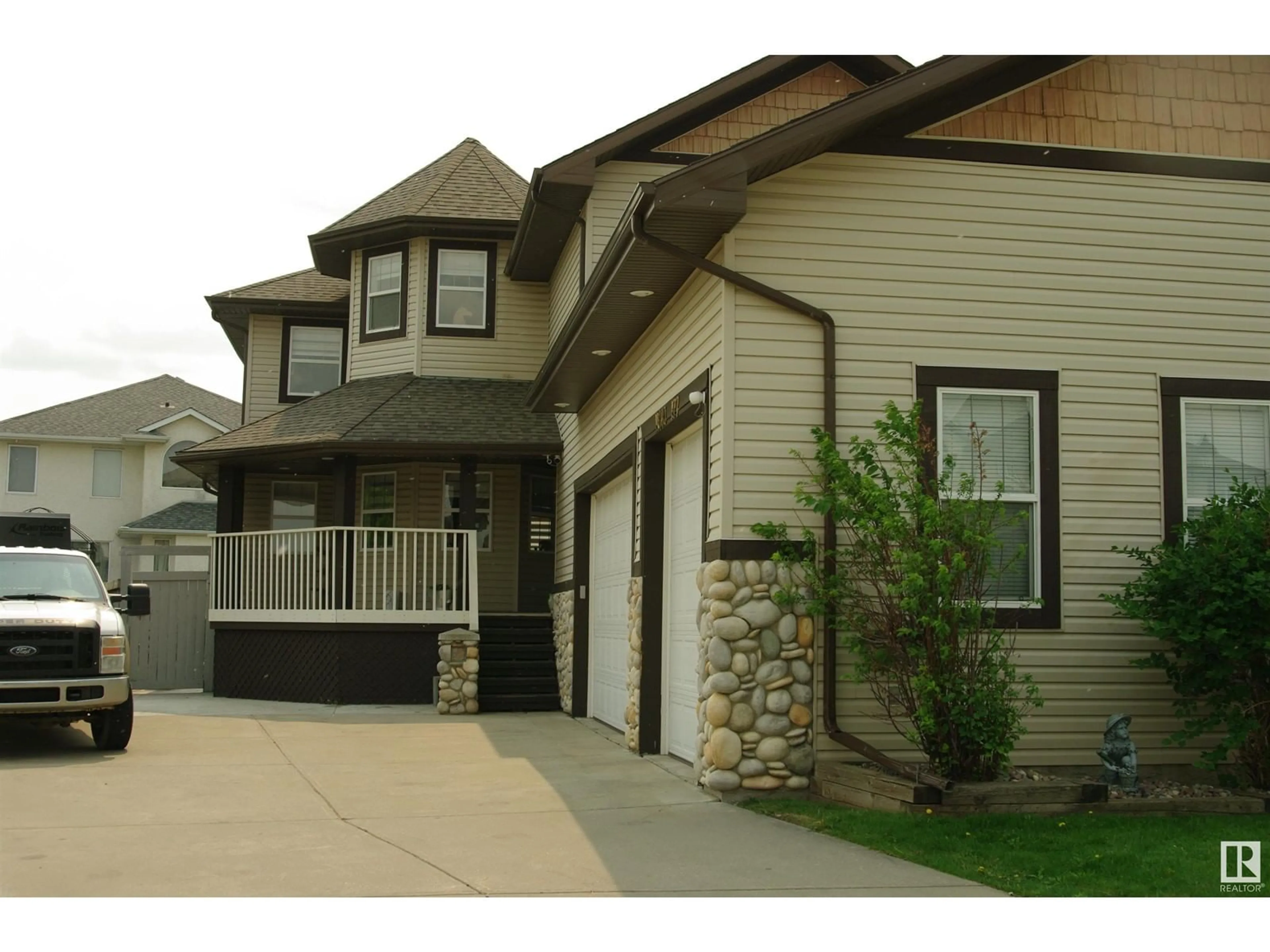Home with vinyl exterior material, street for NW - 11003 177 AV, Edmonton Alberta T5X6H5