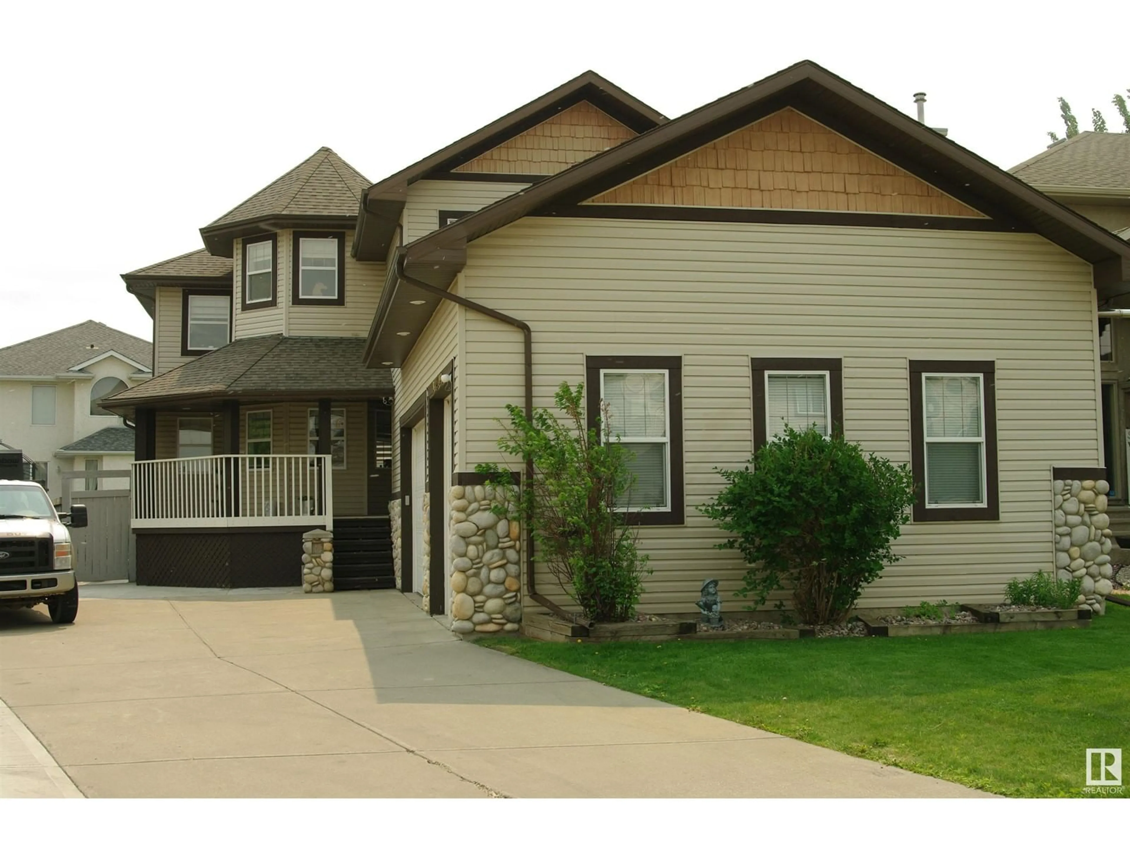 Home with vinyl exterior material, street for NW - 11003 177 AV, Edmonton Alberta T5X6H5