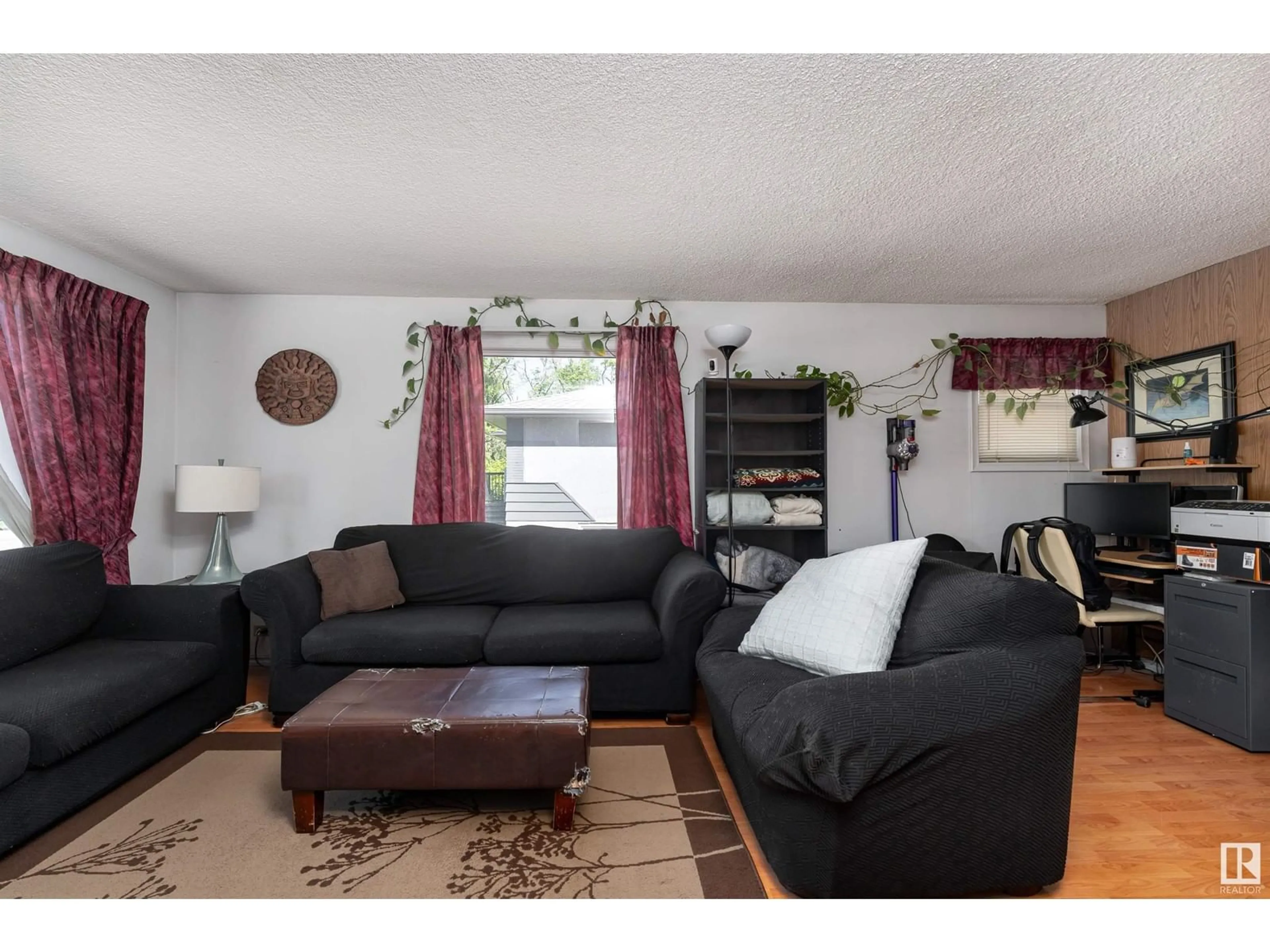 Living room with furniture, unknown for 4527 46 AV, Leduc Alberta T9E5V7