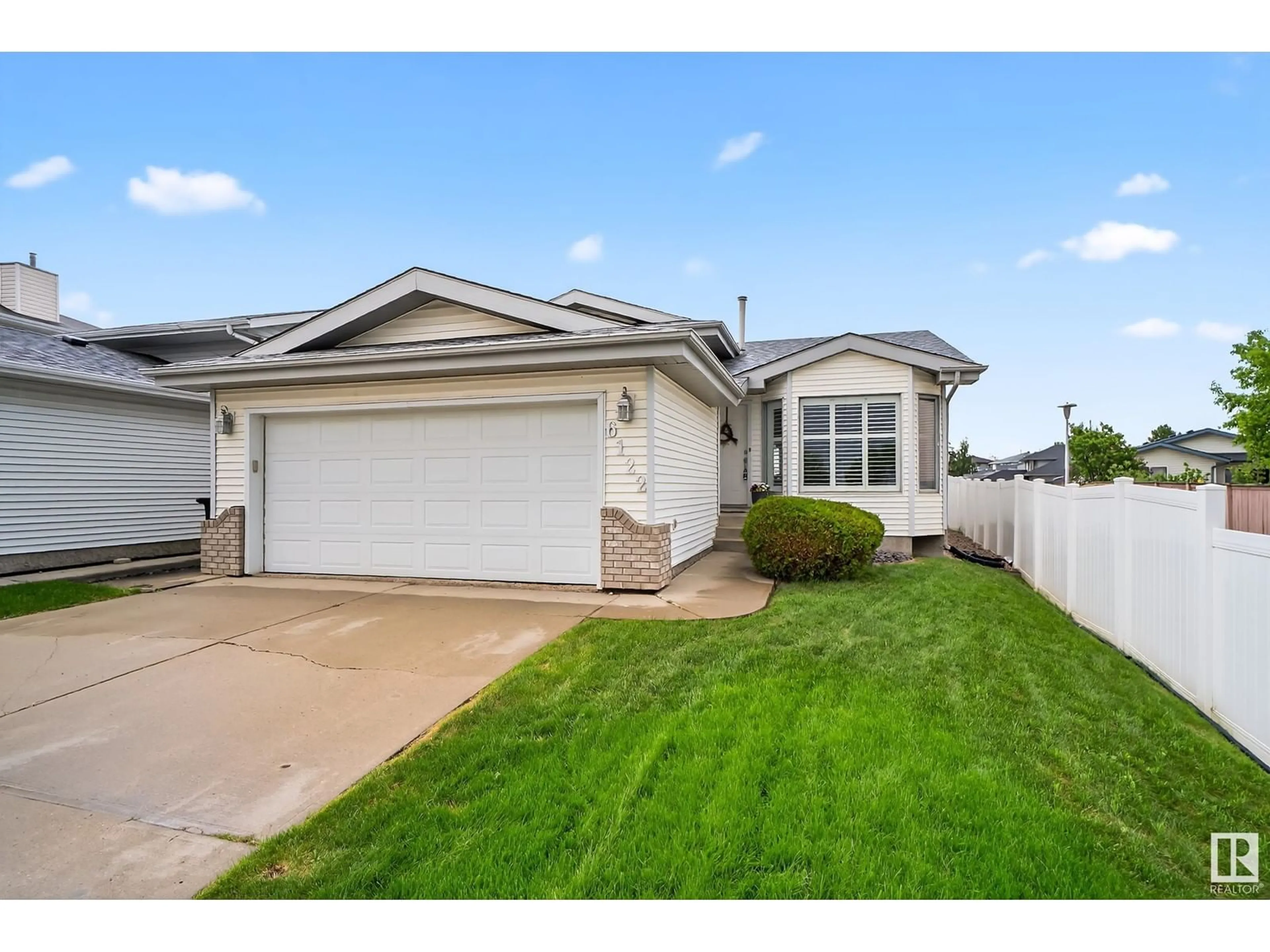 Home with vinyl exterior material, street for 6122 157A AV, Edmonton Alberta T5Y2P5