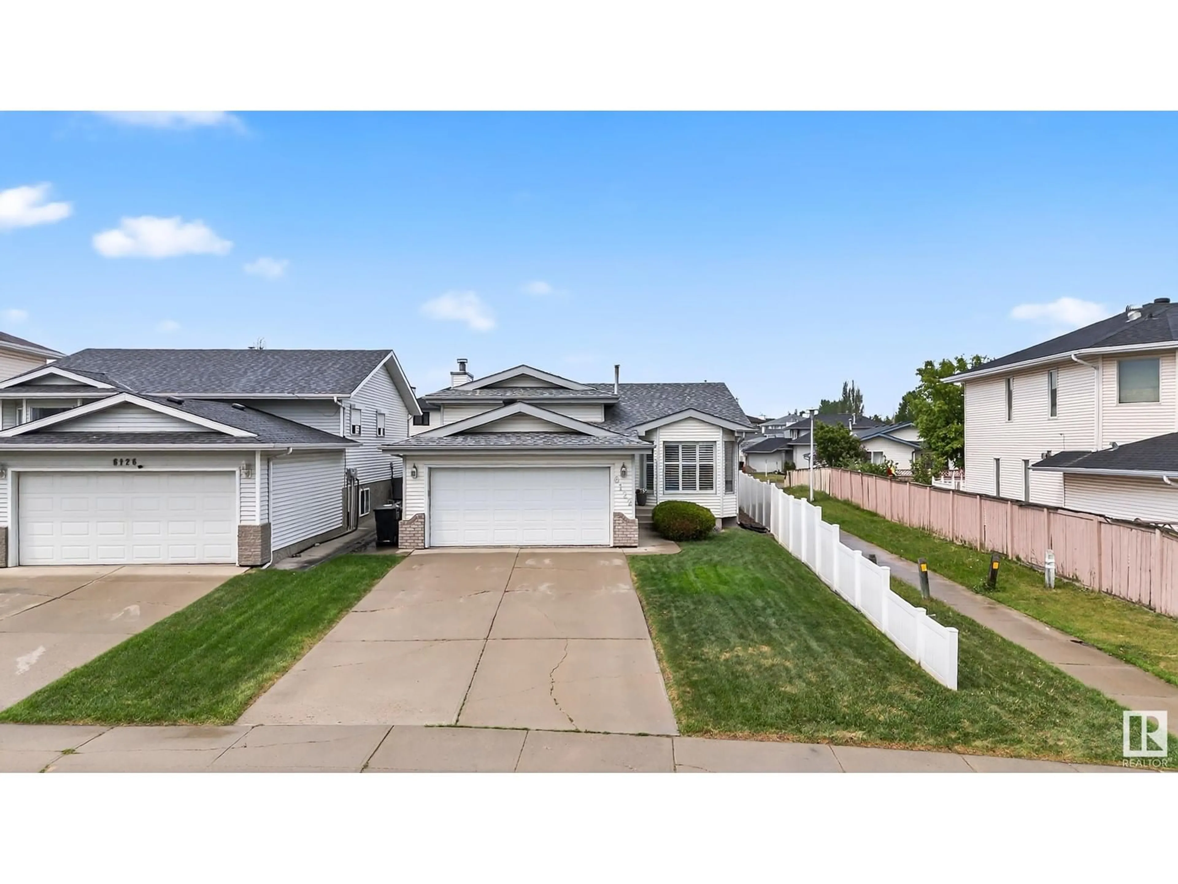 Home with vinyl exterior material, street for 6122 157A AV, Edmonton Alberta T5Y2P5