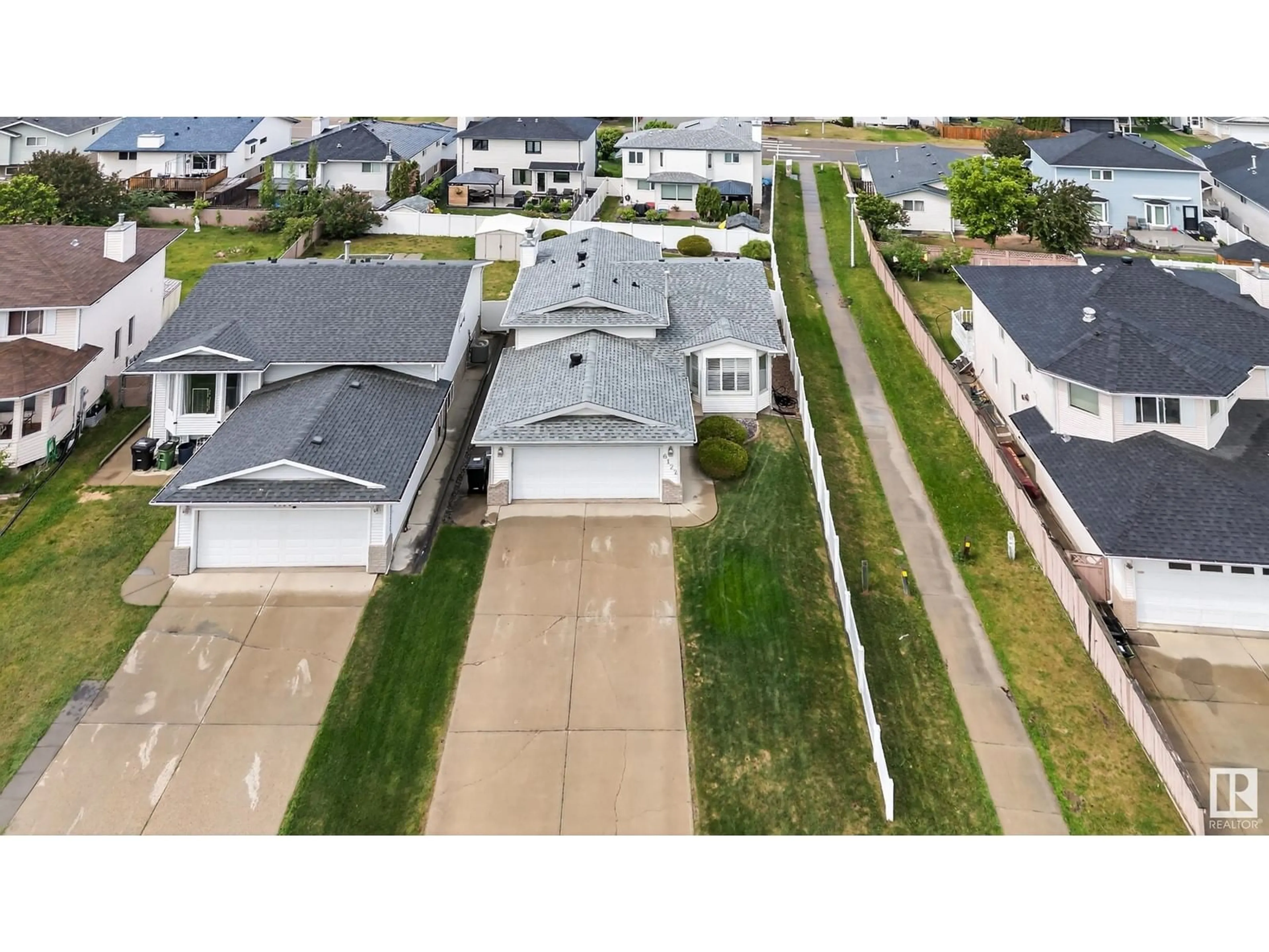 A pic from outside/outdoor area/front of a property/back of a property/a pic from drone, street for 6122 157A AV, Edmonton Alberta T5Y2P5