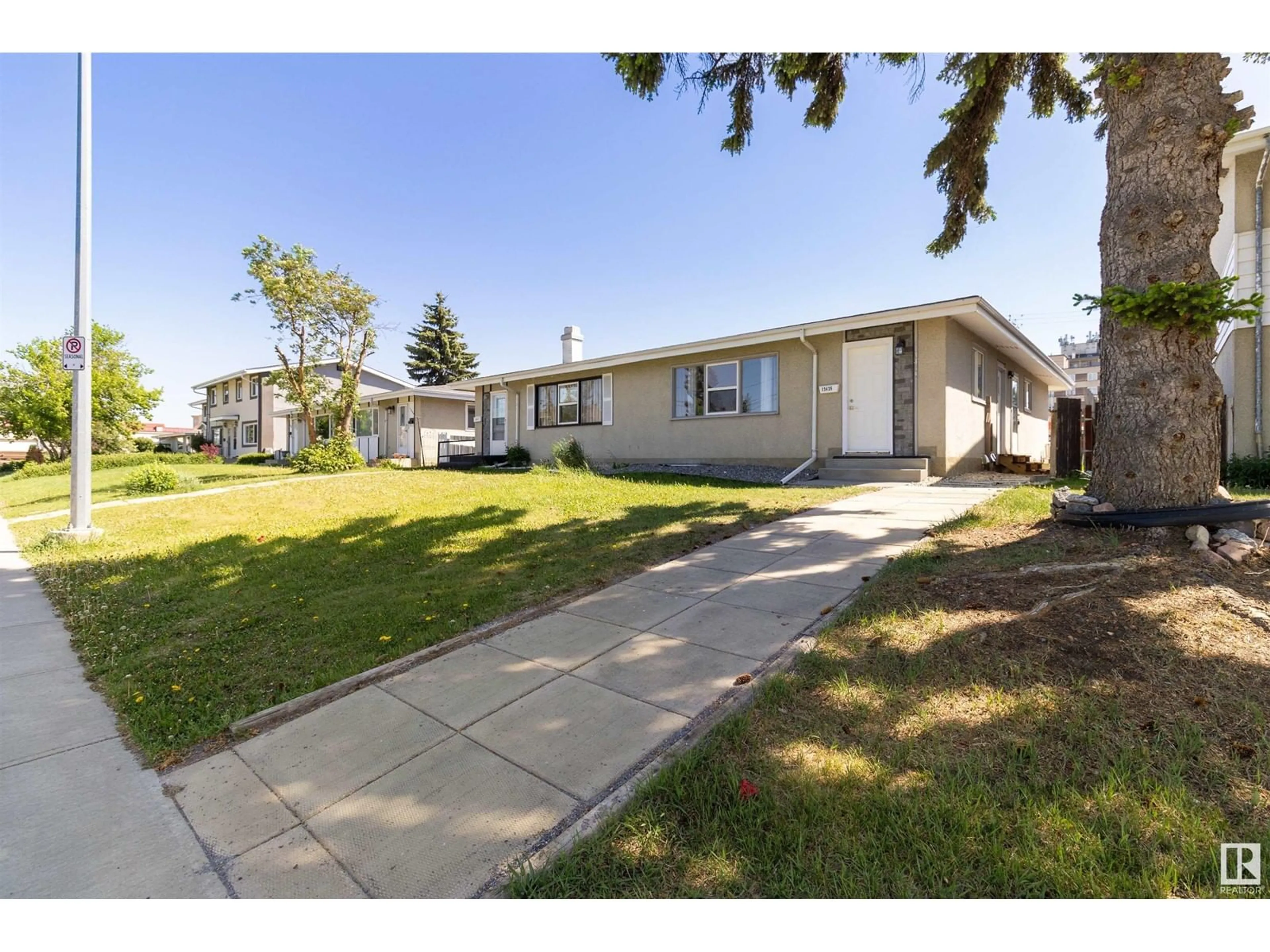 Home with vinyl exterior material, street for 13435 101 ST, Edmonton Alberta T5E4G5