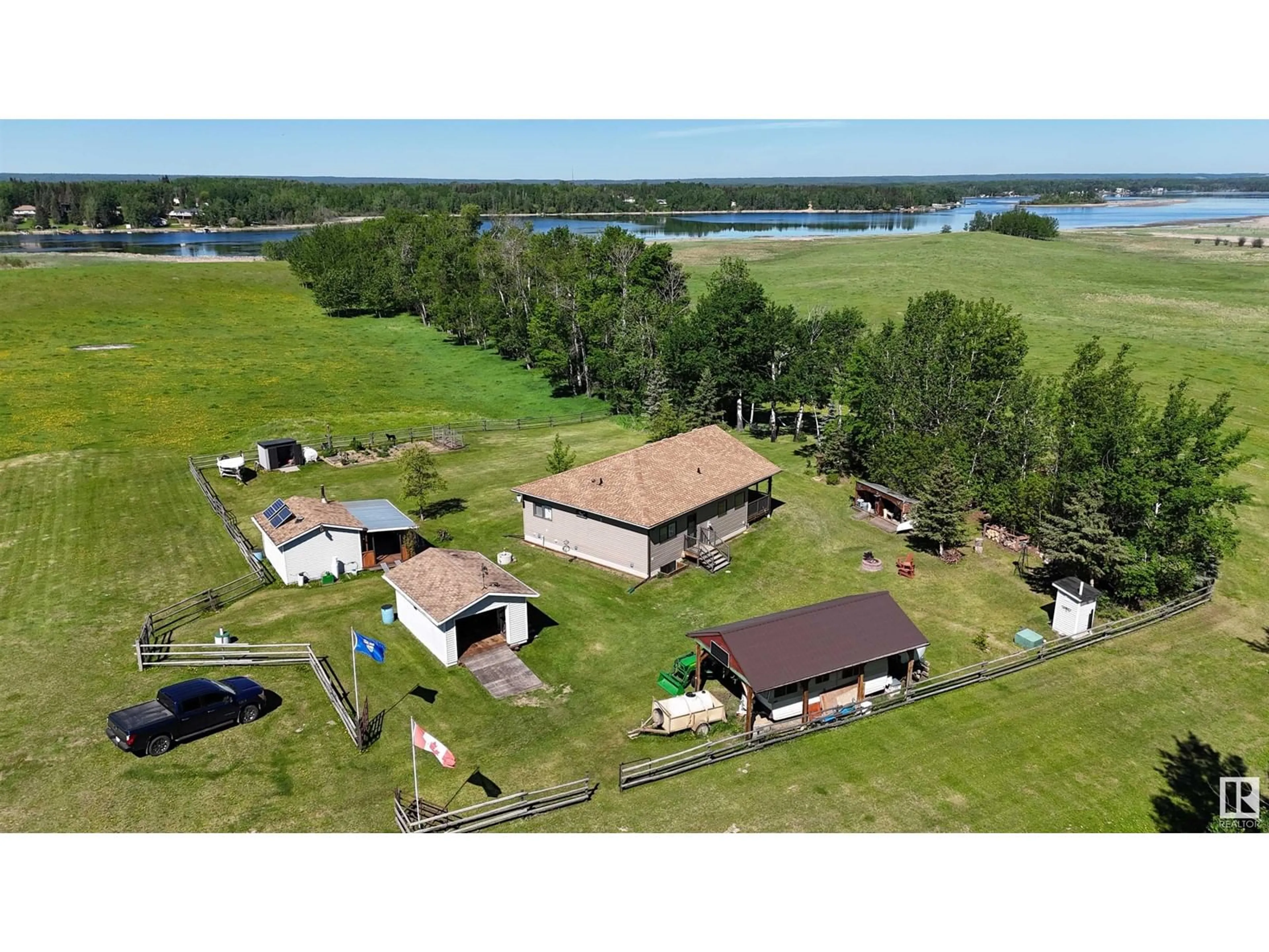A pic from outside/outdoor area/front of a property/back of a property/a pic from drone, water/lake/river/ocean view for 240002 TWP RD 674, Rural Athabasca County Alberta T0S0A1