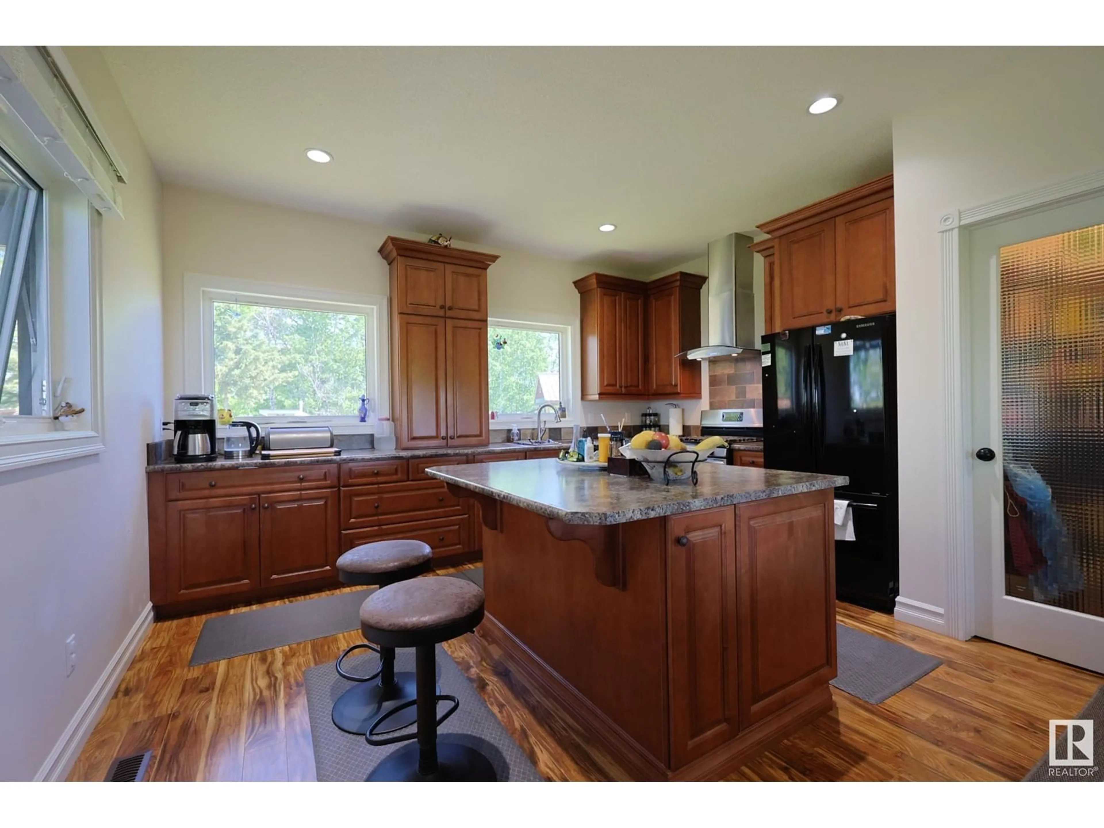 Open concept kitchen, wood/laminate floor for 240002 TWP RD 674, Rural Athabasca County Alberta T0S0A1